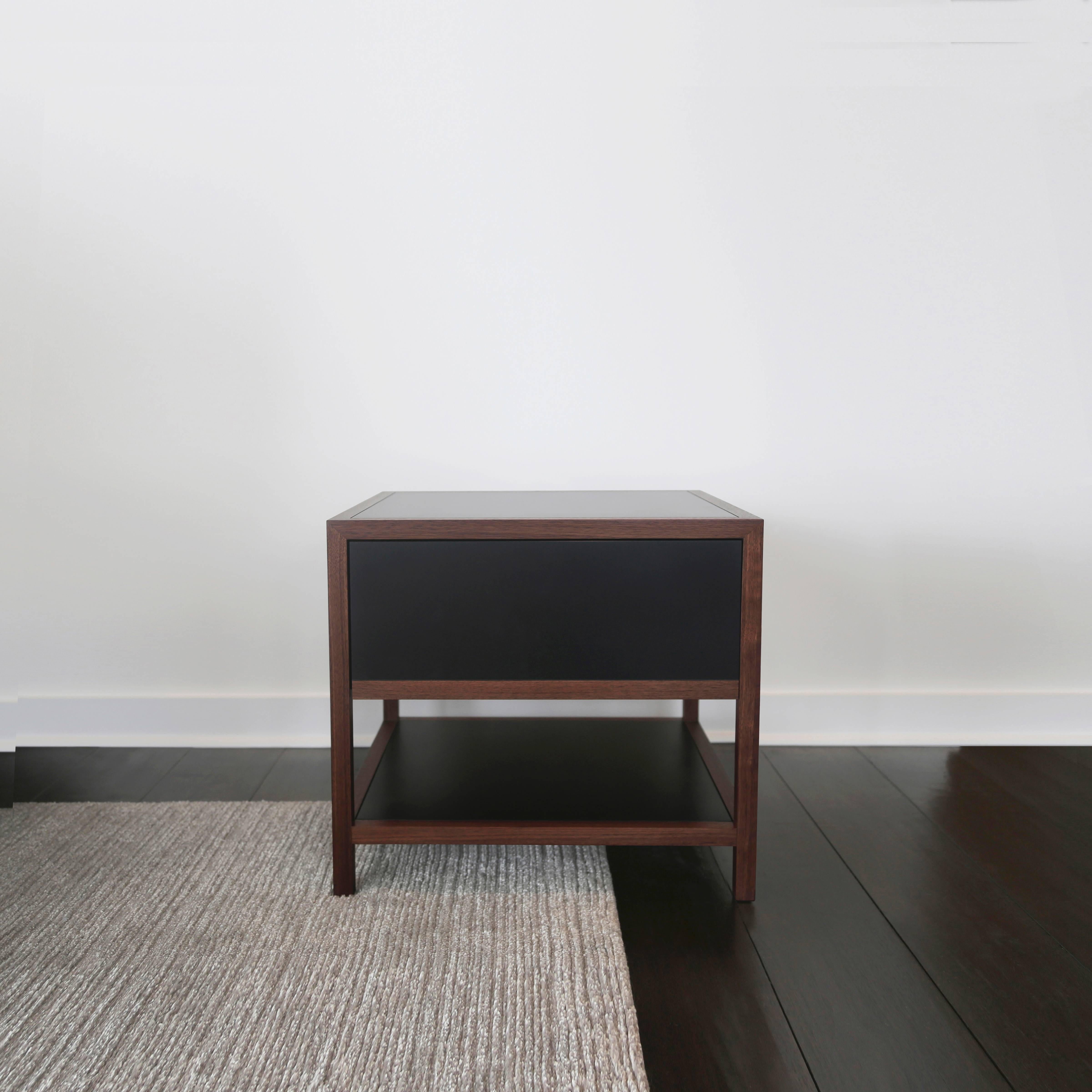 Framed in solid walnut and clad with a recycled paper composite, the Driver Side Table blends classic triple miter joinery with modern building materials. The composite, made of FSC Certified Recycled Paper, has a wax finish that develops a rich