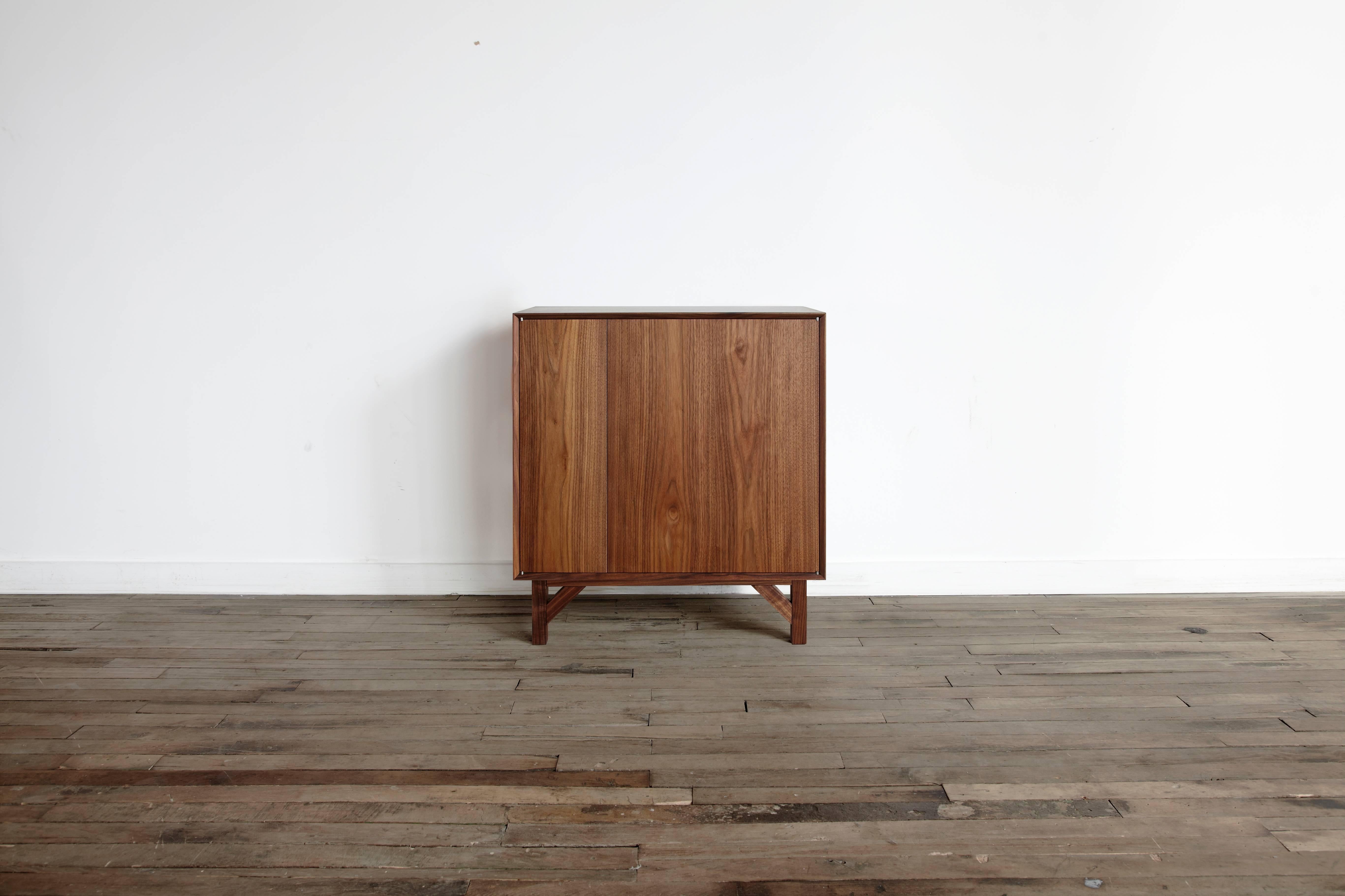 Solid wood hi-fi credenza touch latch doors hand rubbed oil and wax finish.

Dimensions:
33