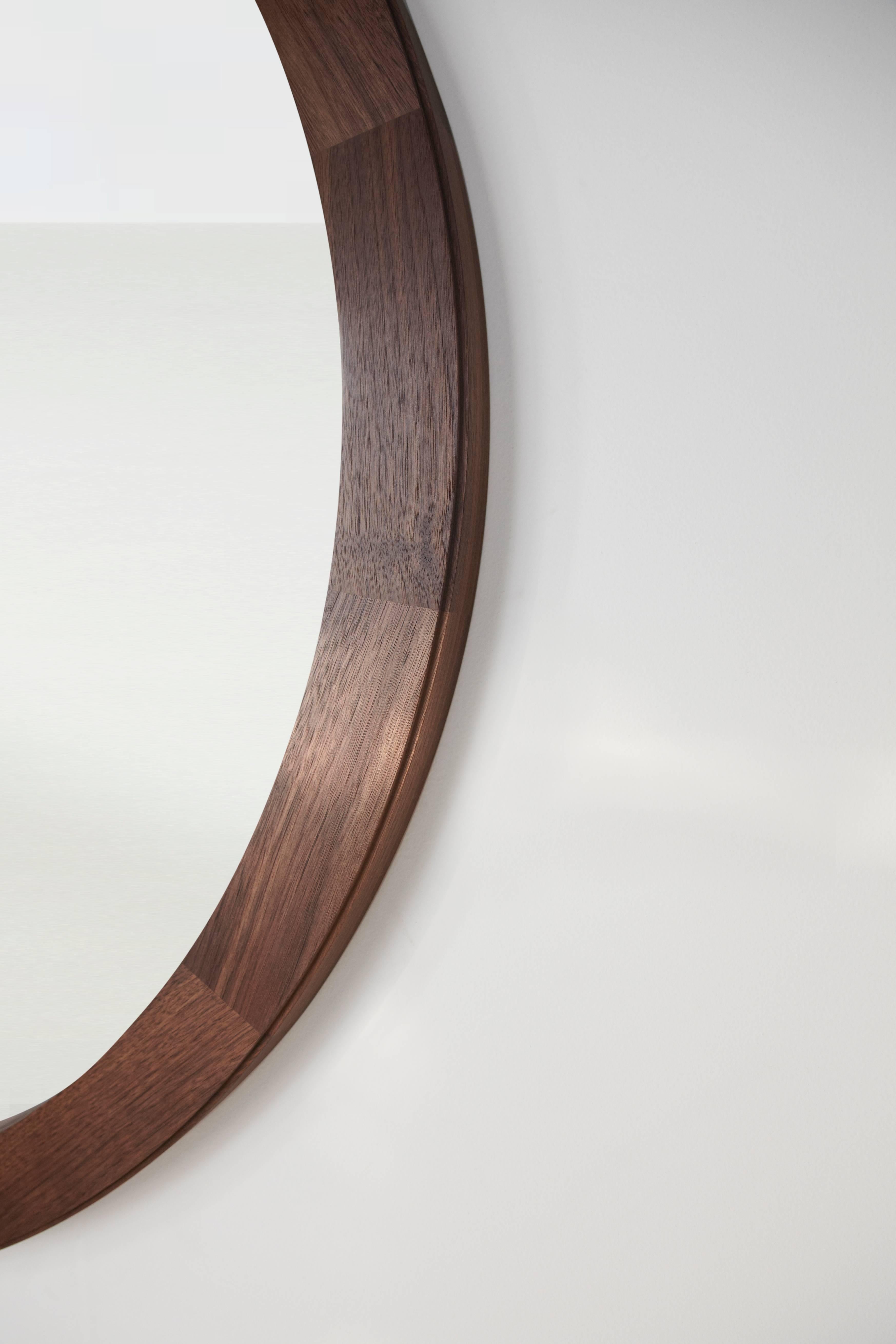 Cirque is a multi-tone wall and floor mirror. 14 wedges of timber are joined together and shaped into one harmonious ring. 

Shown above at 42