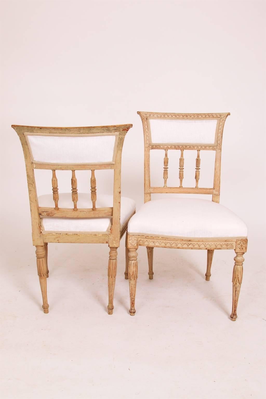 A pair of late Gustavian chairs, circa 1810, Stockholm. Dry scraped to original color and retouched.
   