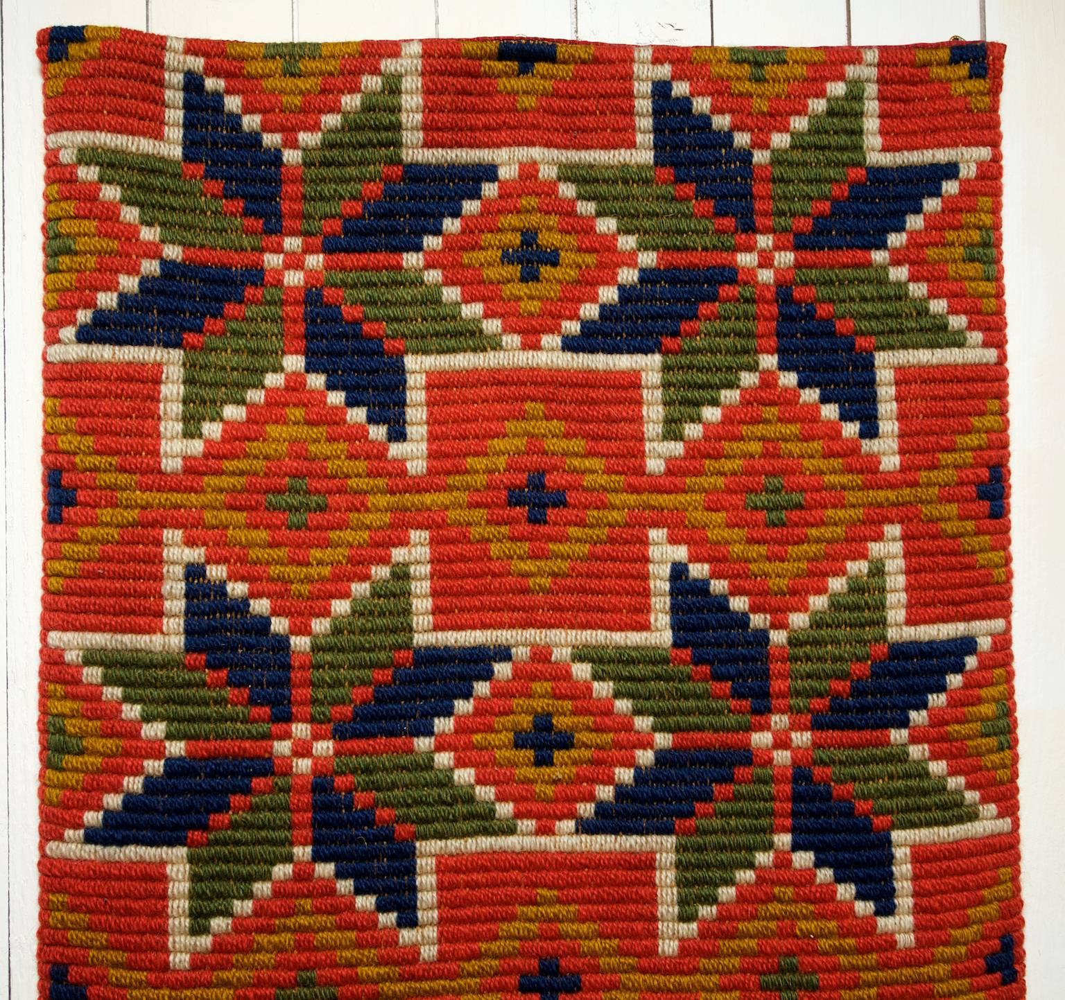 A beautiful traditional large handwoven wool wall hanging from Skåne in south of Sweden, problaby from Oxie or Skytts Härad according to the colours and pattern. 
This large wall hanging has been lined in modern time at the backside for protection