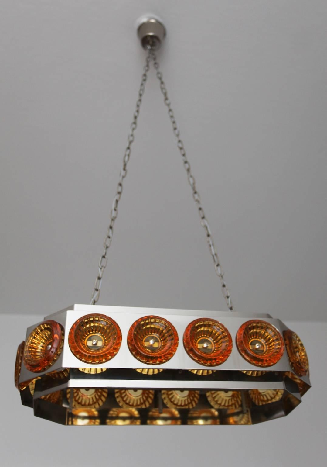 A large Scandinavian pendant with bohemian amber medallions, 1960s. 
Possibly by Carl Fagerlund for Orrefors.