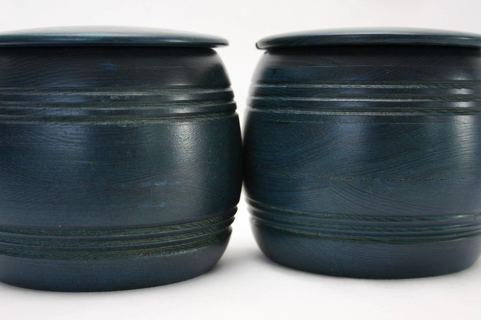 Two very charming wooden jars with lid and inner glass cup. Dyed wood, 1970s manufactured by Smålandsslöjd, in Öjersjö in the south of Sweden. 

These two jars is a very good example of everyday items with a charm and a feeling for the innovative