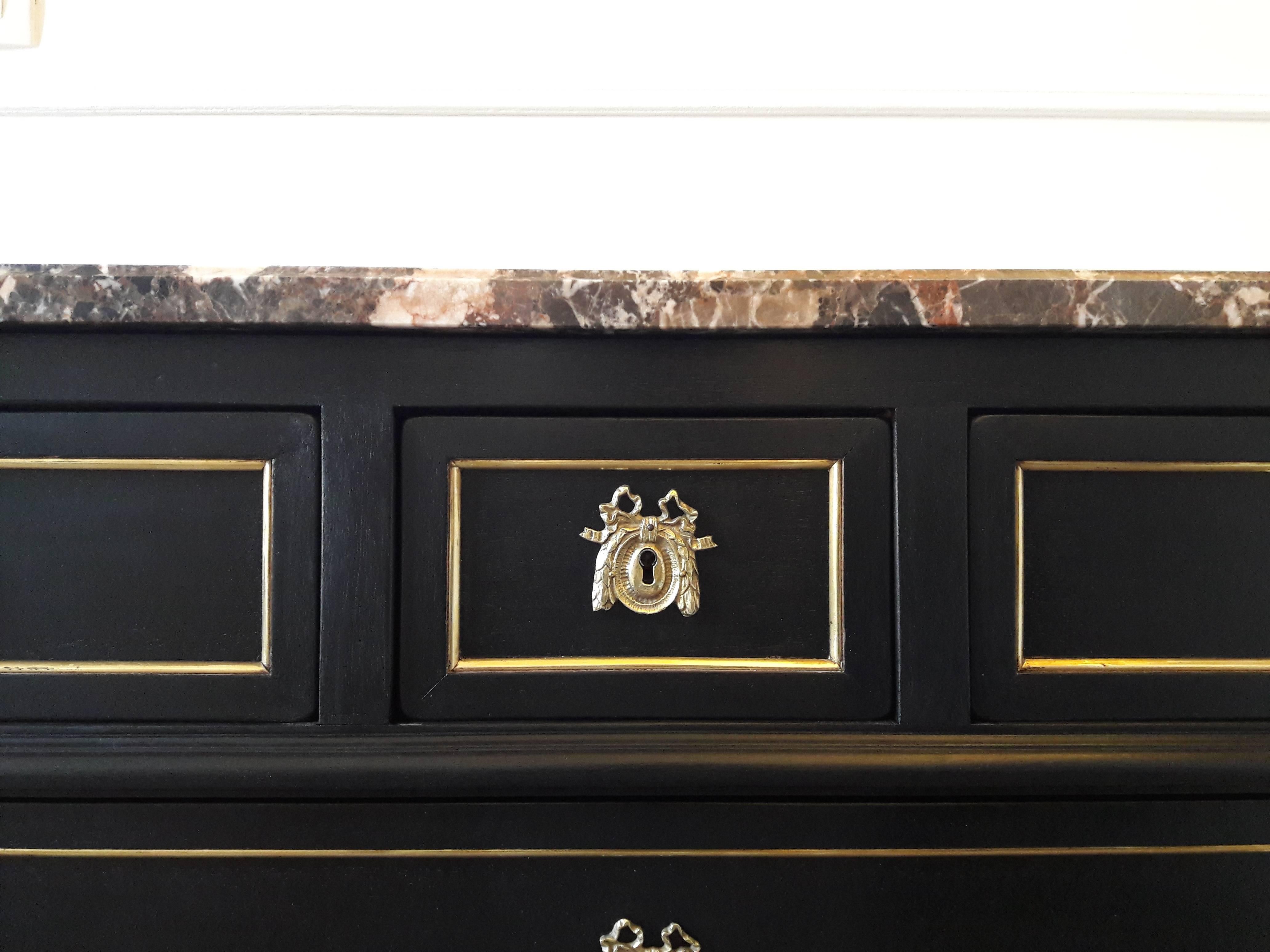 Antique French Louis XVI style chest of drawers topped with a rare and wonderful brown, grey, white and some copper touch marble, named Brèche Nouvelle and from France. Legs are fluted and finished with golden bronze clogs. Five dovetailed drawers