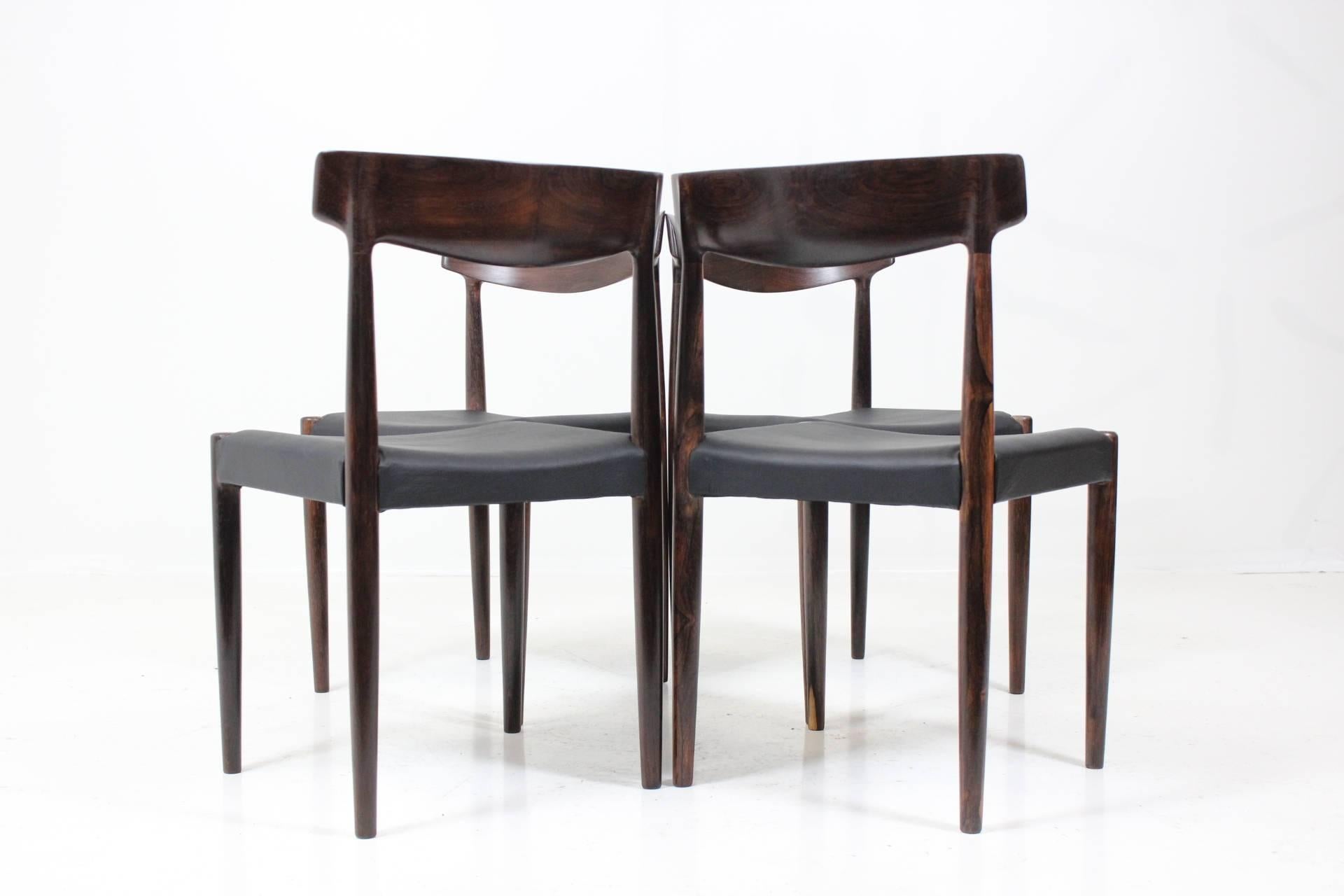 Set of four dining chairs no. 343 in massive Palisander by K. Færch for Bovenkamp. Carefully restored, new leather upholstery in black, very good condition.