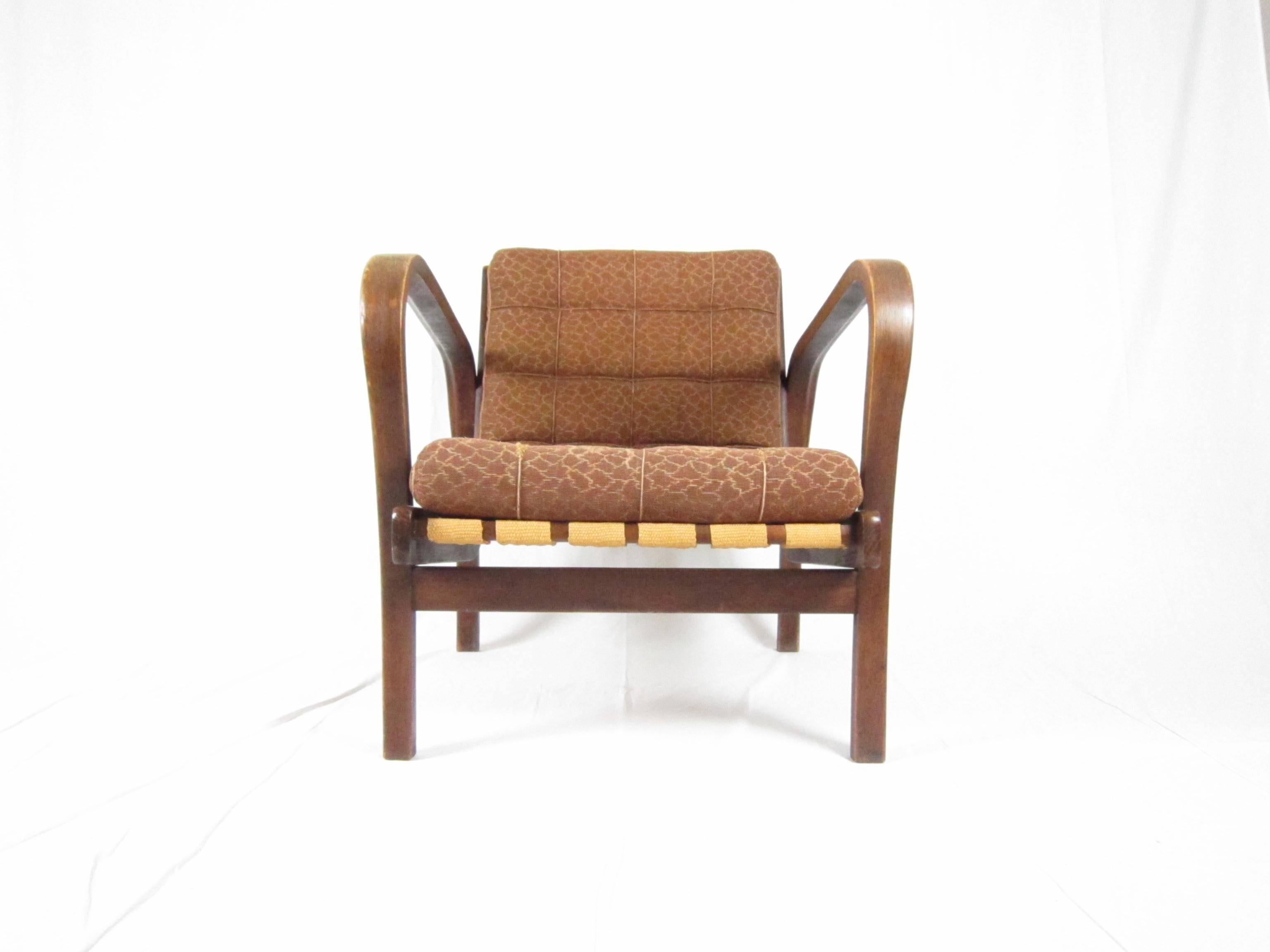 1940s lounge chair made in Czech republik and designed by Karel Kozelka & Antonin Kropacek. This model won the silver metal at the Triennale in 1944. 
The item is in very good original condition (including fabric upholstery).