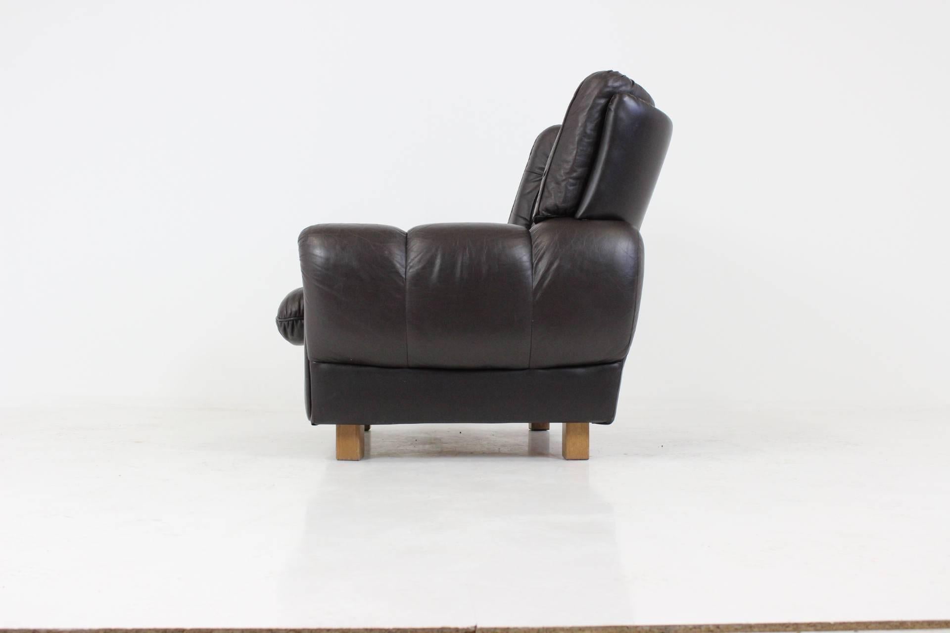 Leather brown armchair made in 1970ss in Czechoslovakia. Very comfortable, signed by marker, good, original condition. Height of seat is 40cm.