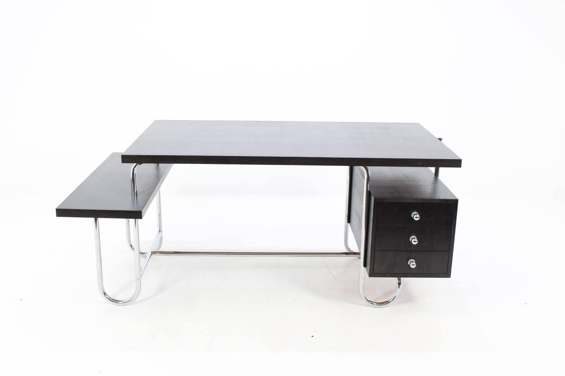 Huge design writing desk in good condition. The tubular steel construction is newly chromed, all wooden parts are completely new, perfectly done. It shows some marks of using. Three drawers.