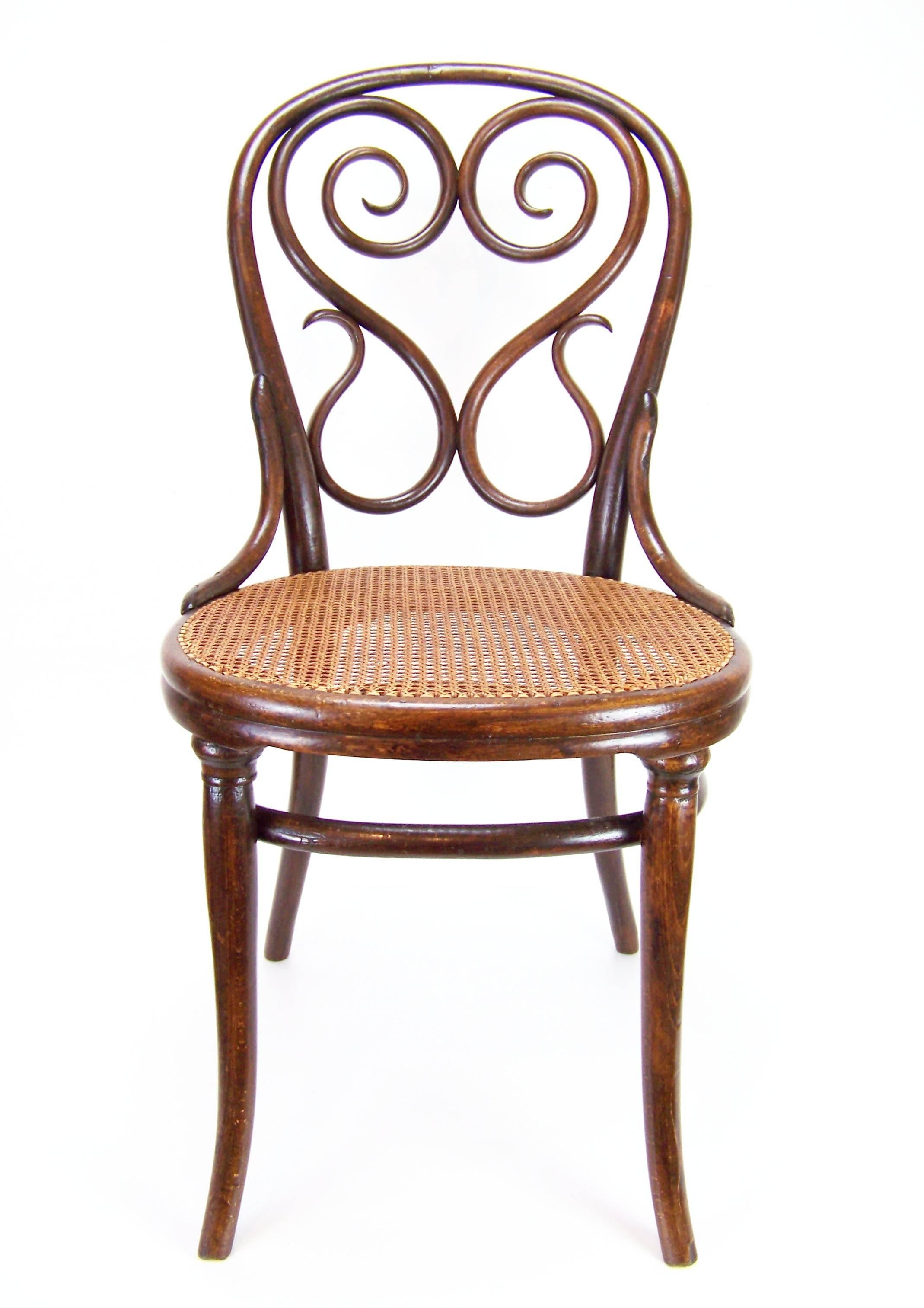 Manufactured in Austria by the Gebrüder Thonet Company. In the production program was included around the year 1850. It's very early model. Marked with paper label and stamp, which is used around year 1885.