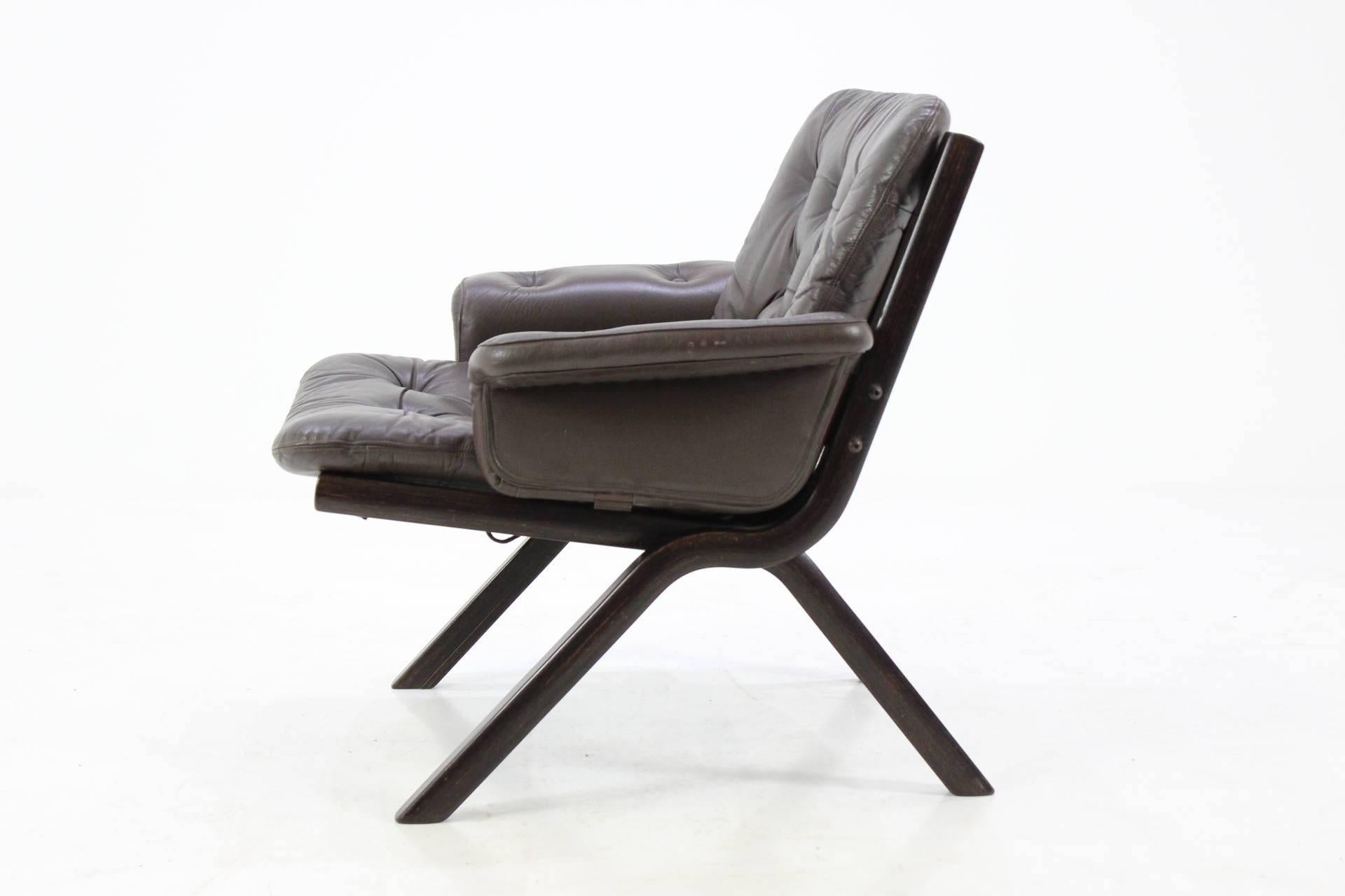 Danish bentwood armchair, 1960s. This armchair has original upholstery in dark brown leather .The item is in very good original condition.