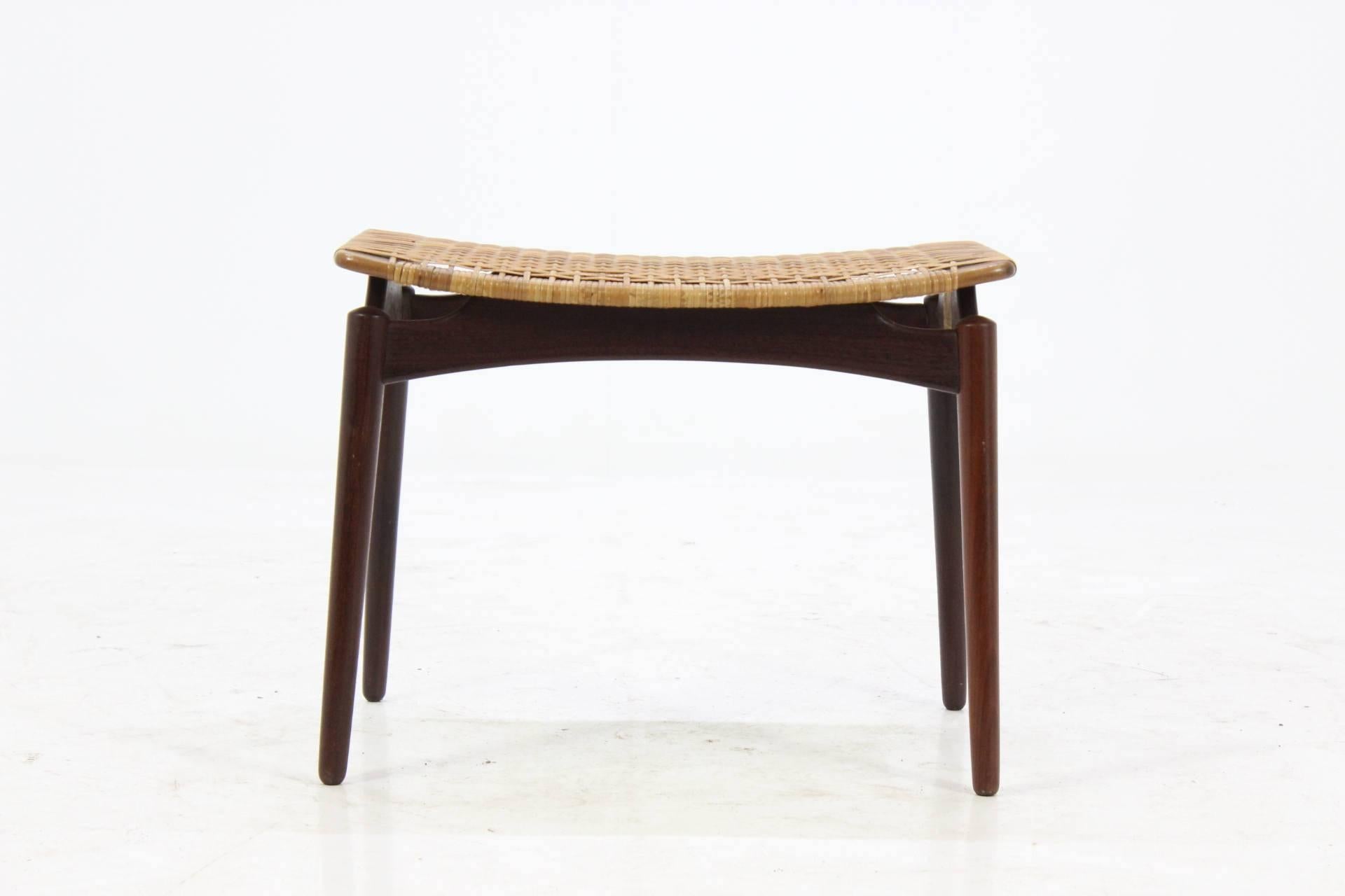 Very nice shaped Danish teak stool with string seat. The seat is sturdy and comfortable.