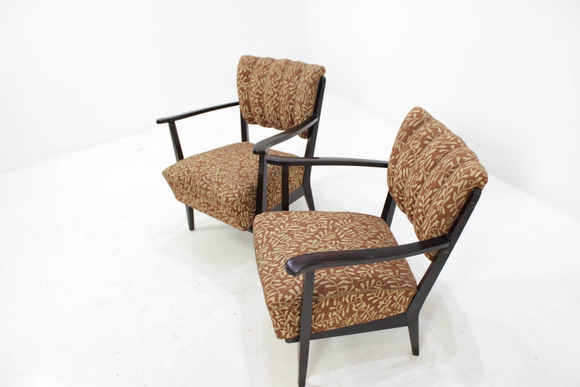 These chairs are in good original condition included fabric upholstery. Minor signs of wear due to age.