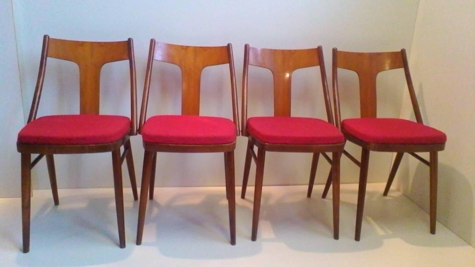 A set of four Art Deco armchairs in walnut and beech. The chairs were produced during 1960s in Czechoslovakia and are in original very good condition.