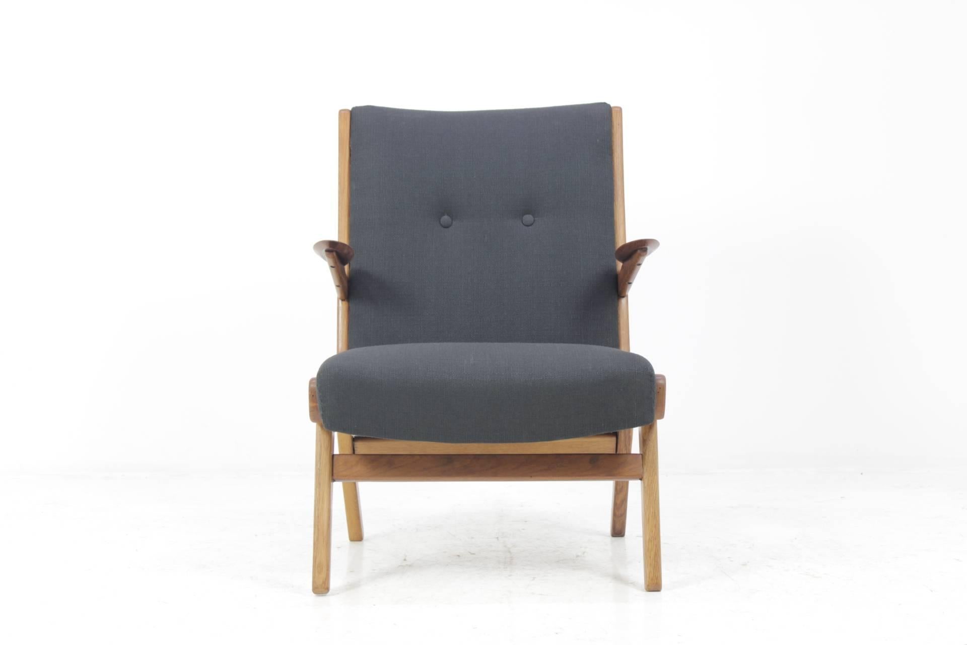 The chair features wooden oak frame and new fabric upholstery .Very good condition