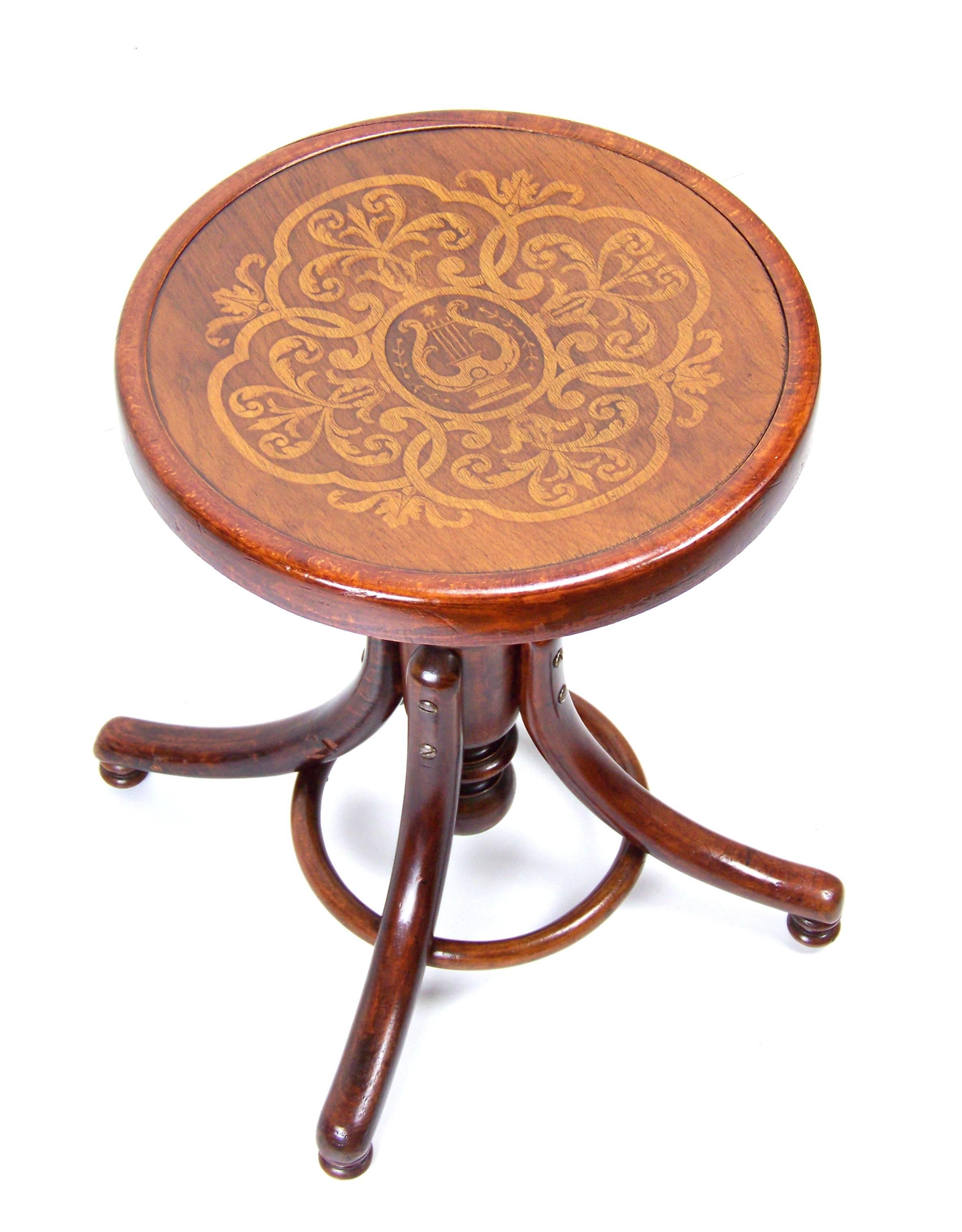 Height adjustable rotating tabouret. The height of the seat is adjustable from 47 to 58 cm. Luxury design - Massively constructed base, decorative bottom legs, cast iron elements are plated with brass, the screws are copper-plated. The seat is with
