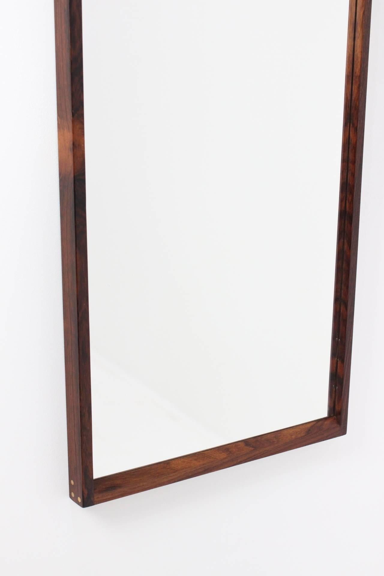 This mirror has craftsmanship and details, such as the visible wooden plugs on the edges. This item is in perfect original condition.