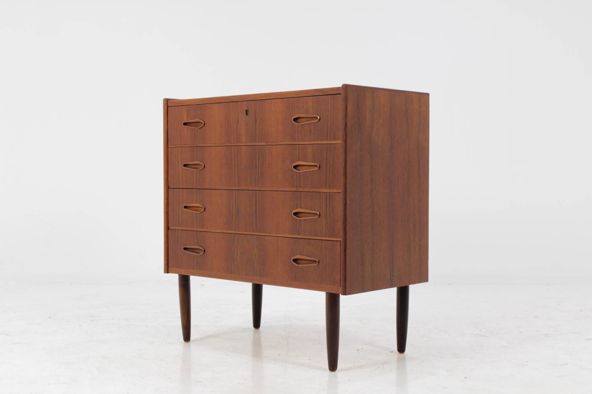 This commode features four drawers. The item was carefully restored.