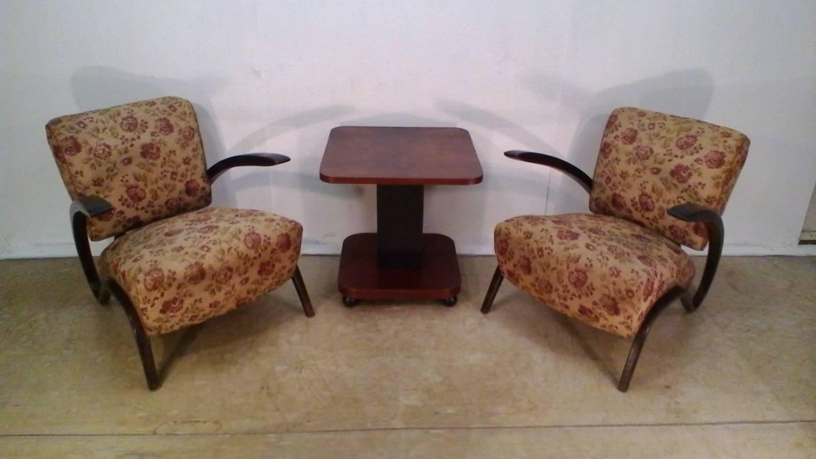 Both H-275 armchairs and coffee table are in very good original condition .The coffee table dimensions (walnut veneer) are: H: 58 cm x W: 57 cm D: 57 cm.