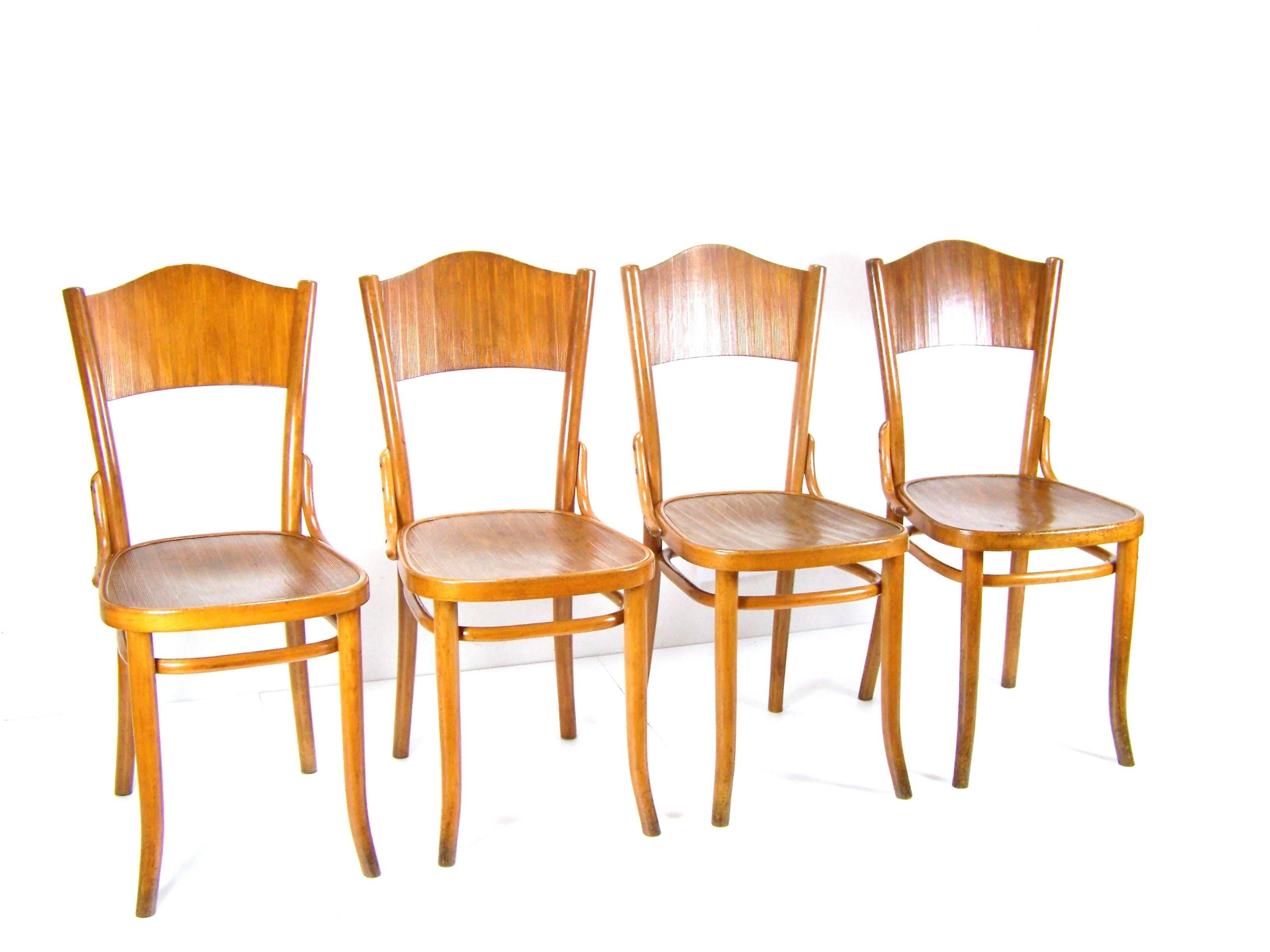 Manufactured by the Thonet company, circa 1920. Bent beechwood. Original condition with minor signs of use. Chairs was cleaned and gentle re-polished with shellac finish. Tinny traces od woodworm (already inactive). One hind leg was repaired. Seat