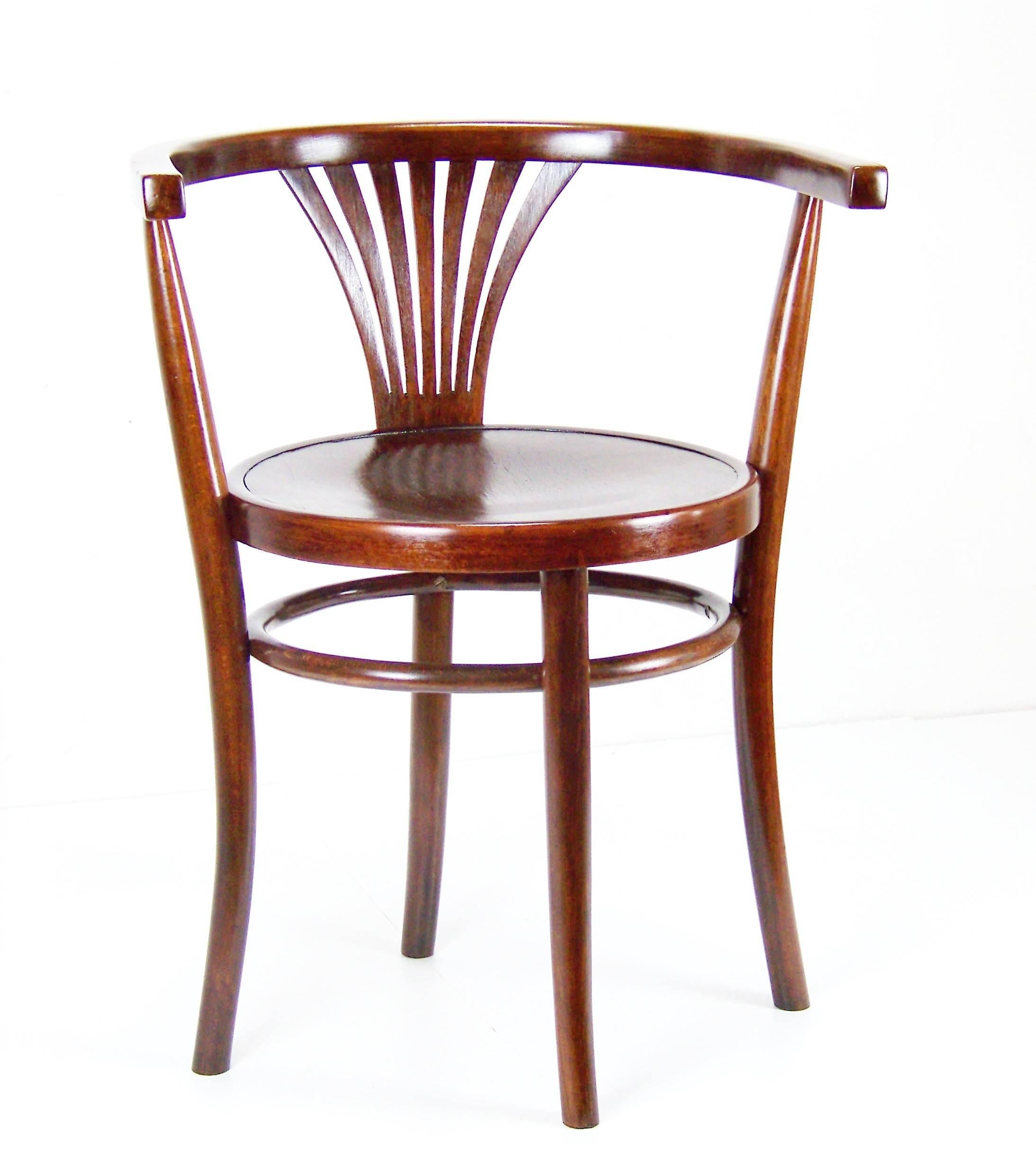 Manufactured by the Tatra company , circa 1920 (Thonet competitor). Bent beechwood. Original condition with minor signs of use. Armchair was cleaned and gentle re-polished with shellac finish - medium walnut shade. Measures: Seat diameter 42cm.