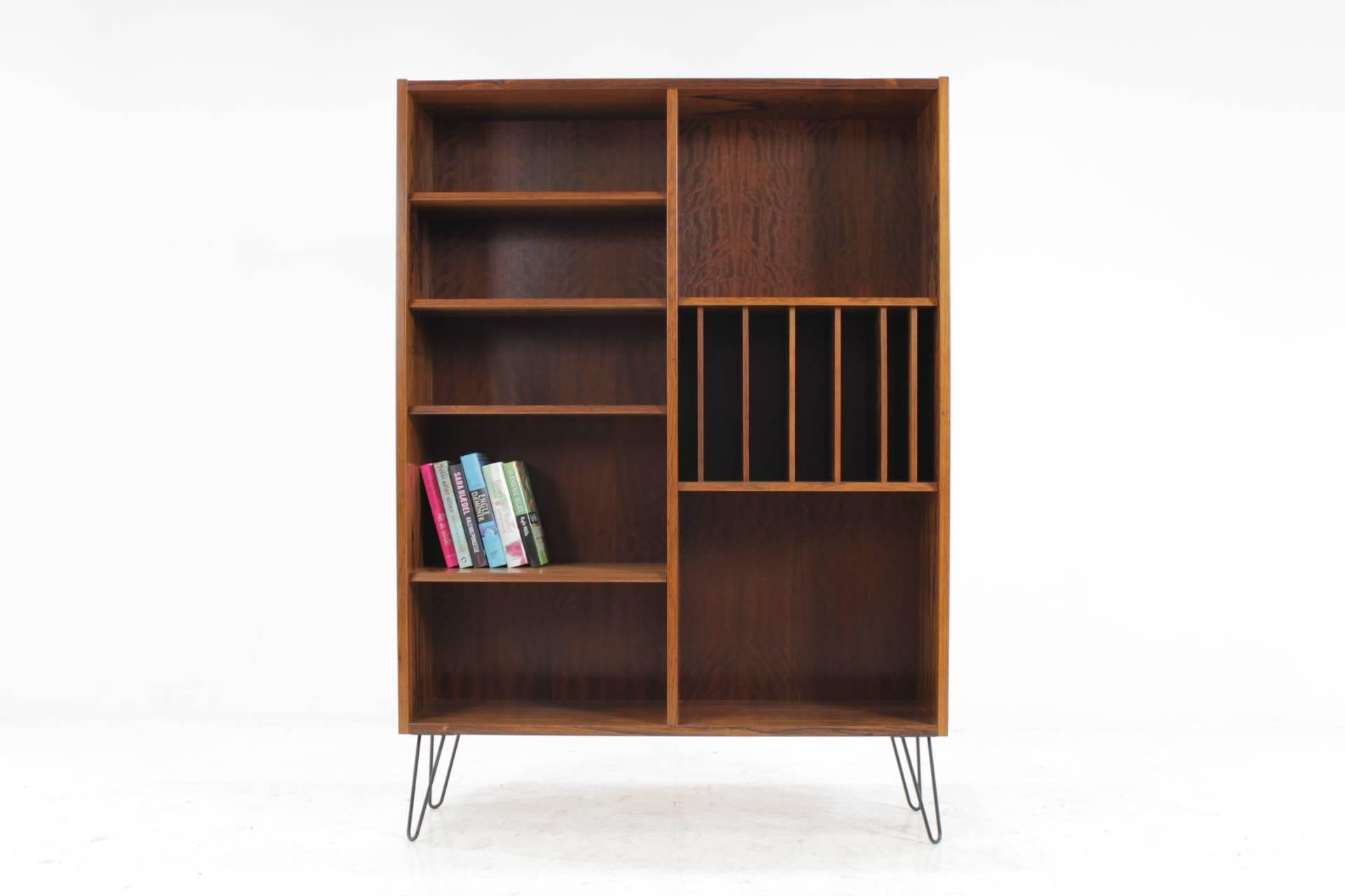 This bookcase was carefully restored. The hairpin iron legs were added afterwards. All shelves are adjustable.