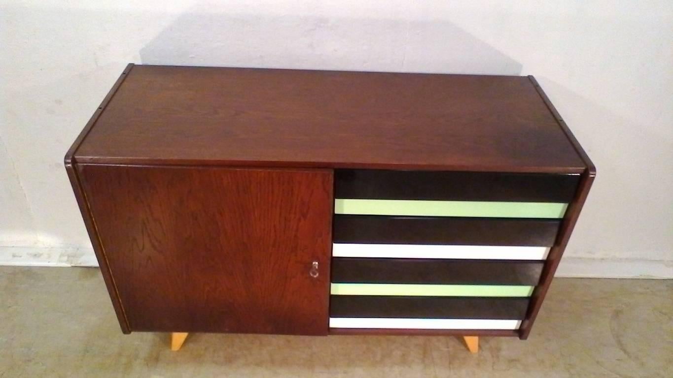 Retro wooden drawer chest, veneer in the style of stained oak, made in 1963 by the design of Jiri Jiroutka in 1950, manufacturer of Interier Praha. Completely restored.