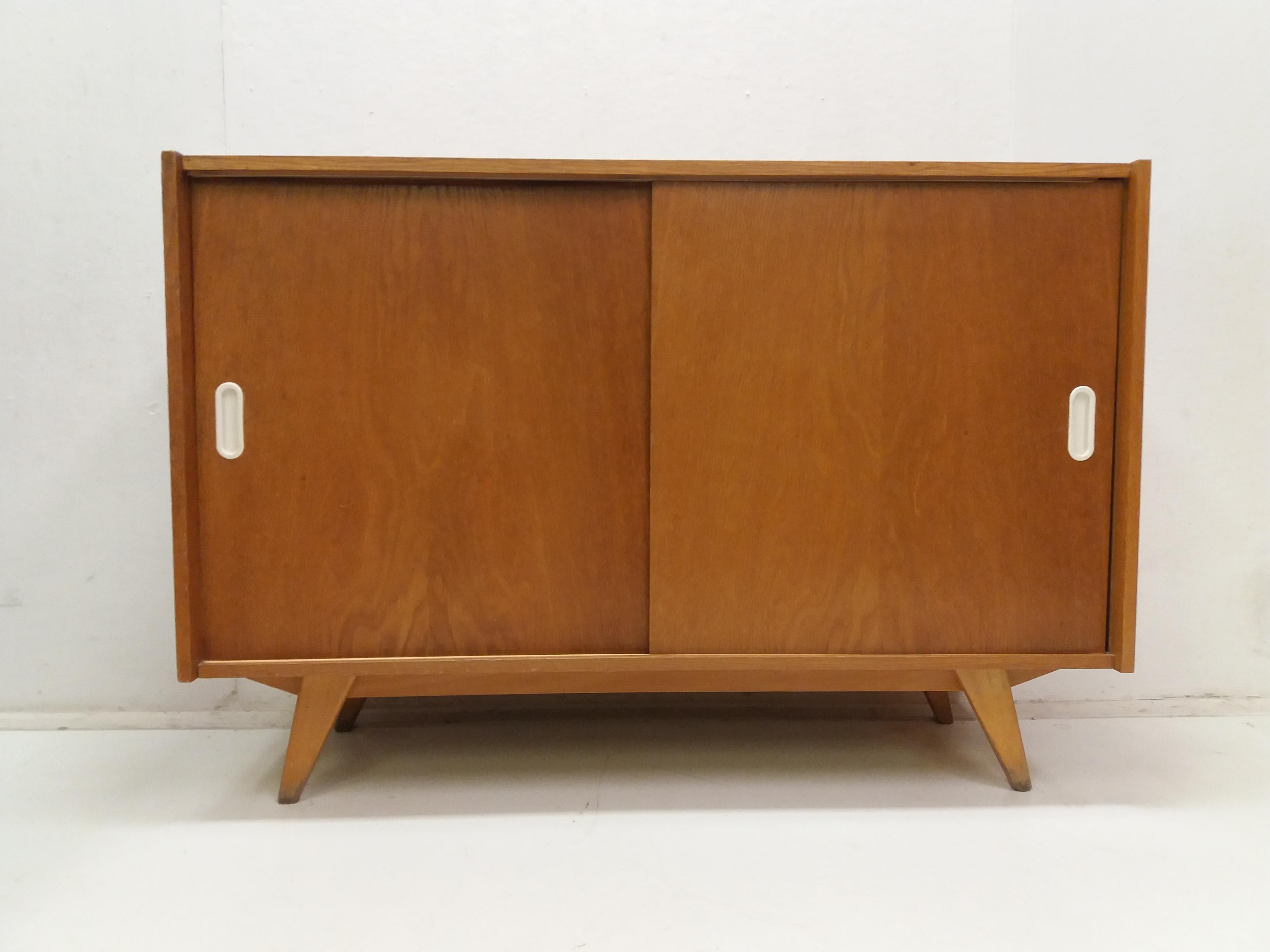 - Wooden veneered chest of drawers-veneer bub with sliding doors
- original very well preserved condition. 
- Design by Jirí Jiroutek 1958, production Interior Prague Czechoslovakia.
   