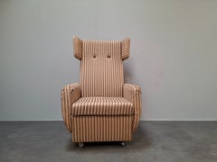 Mid-Century Modern Wingback Lounge Armchair on Castors in Original Upholstery