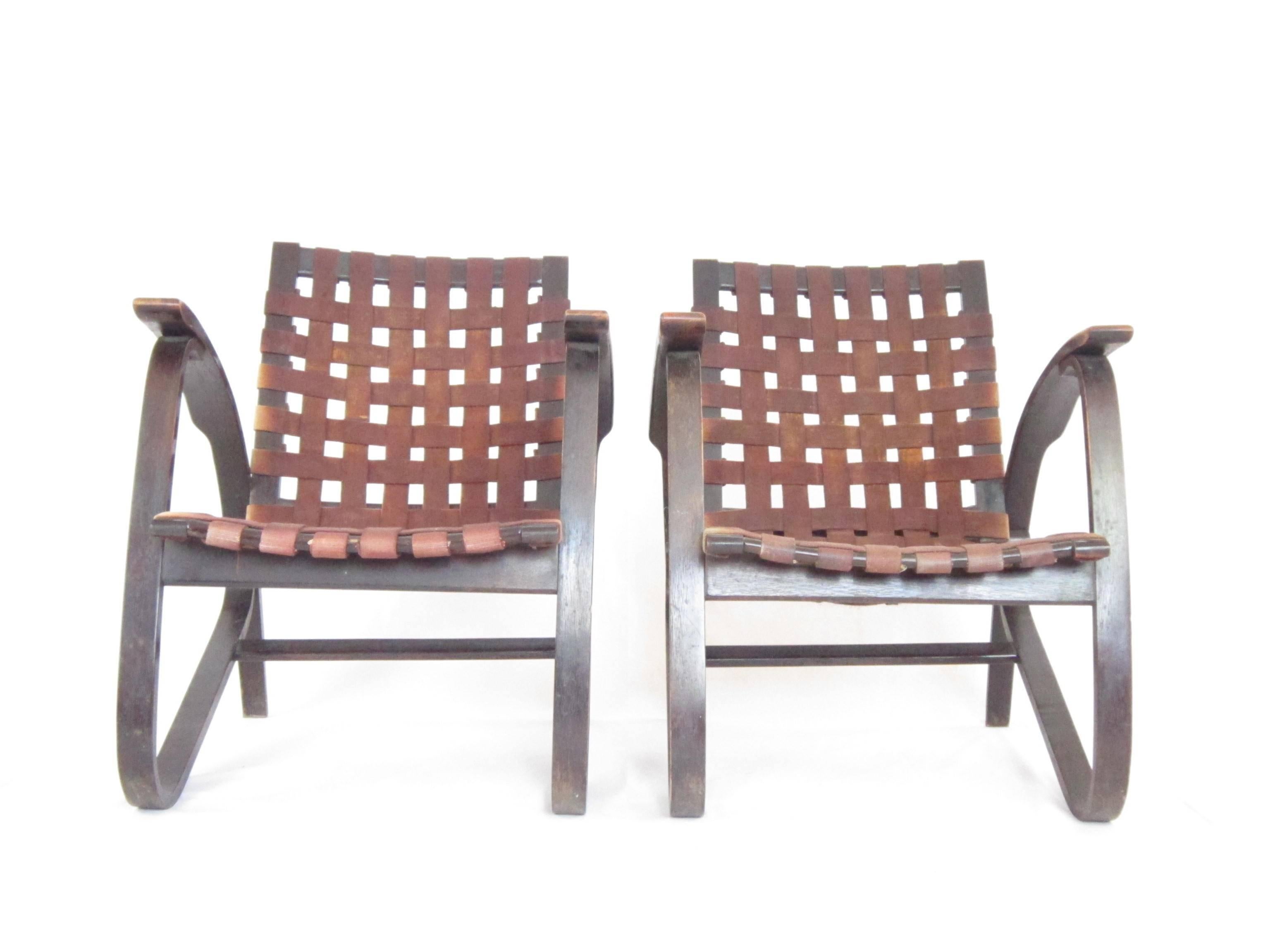 This streamline lounge chair by Czech designer Jan Vanek has beautiful bentwood beech arms and thick canvas straps that have been woven to make the seat and backrest. The strips are in good condition and the chairs are ready to use. The quoted
