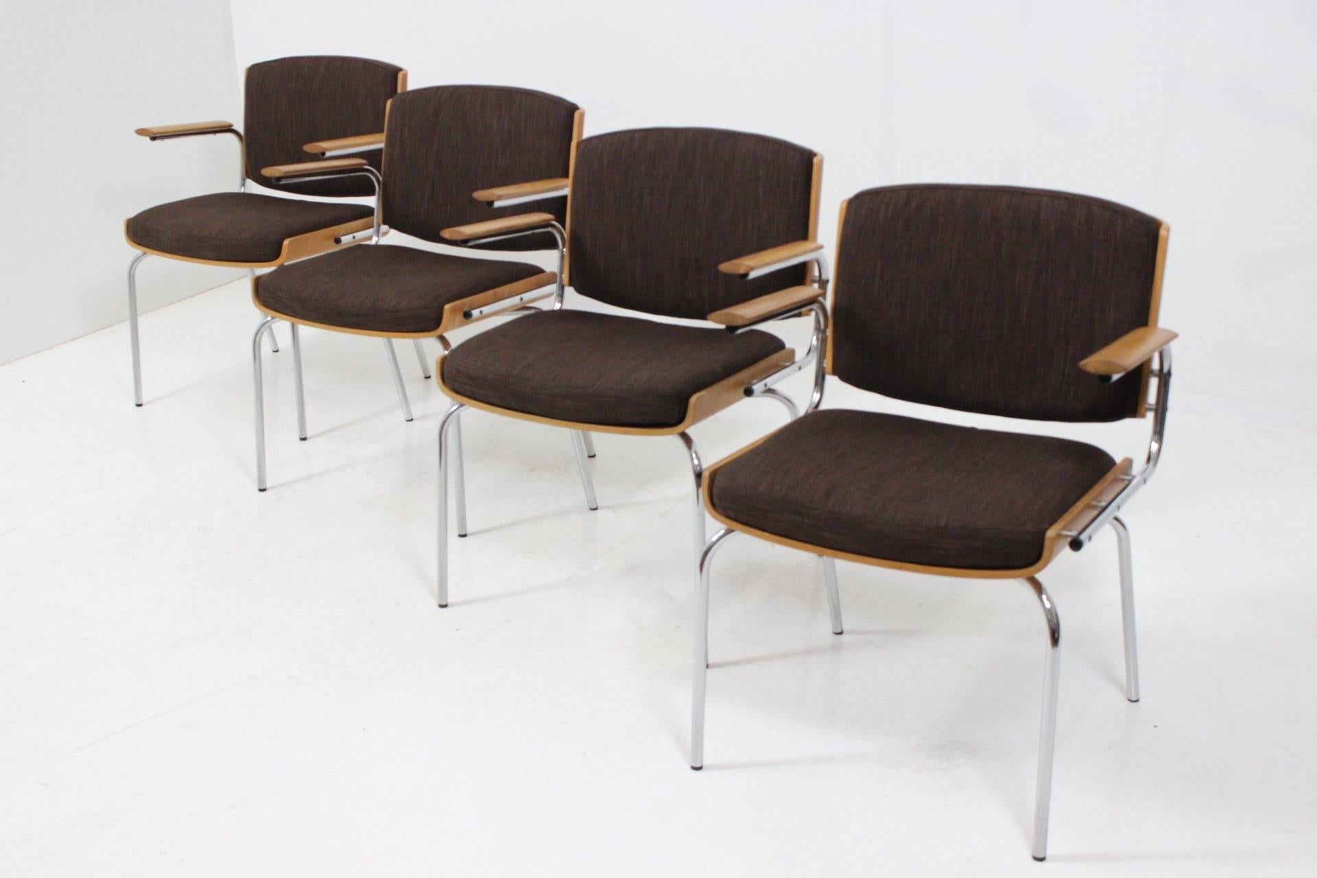 A set of four dining chairs manufactured by Duba Møbelindustri featuring tubular legs and armrest in chromed steel and seat and backrest in bent plywood. Carefully restored, updated upholstery, very good healthy condition.