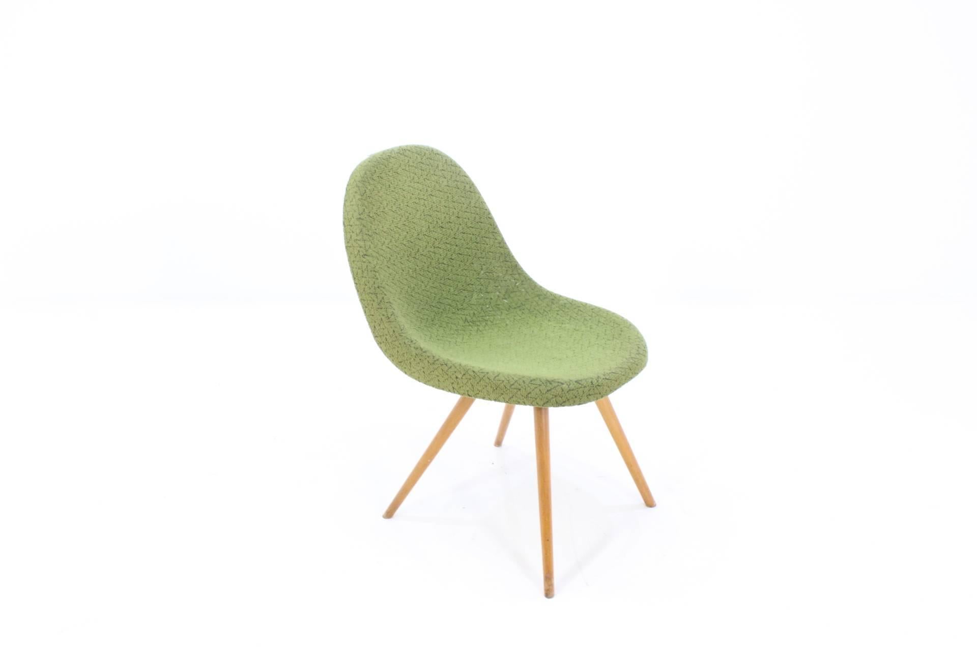 Very popular Czech design chair, 1950s. Designer Miroslav Navratil. Original condition. One place on the back of a slightly torn upholstery. Chair is solid and very comfortable.
