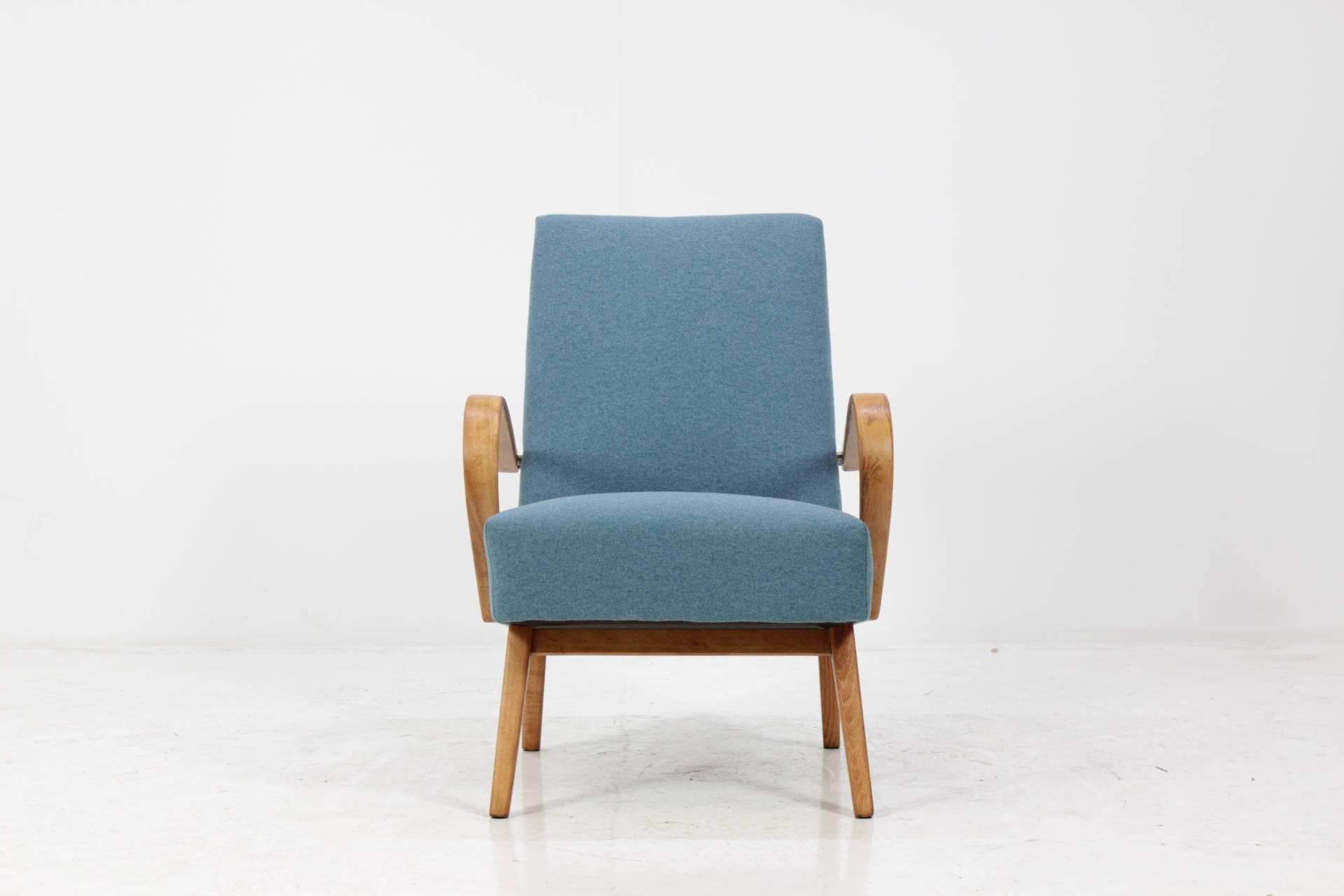 This chair was made in Czech Republic during 1960s by Thon company (before Thonet). Legs and bentwood armrests are made from beech wood and features new fabric upholstery. Very good condition.