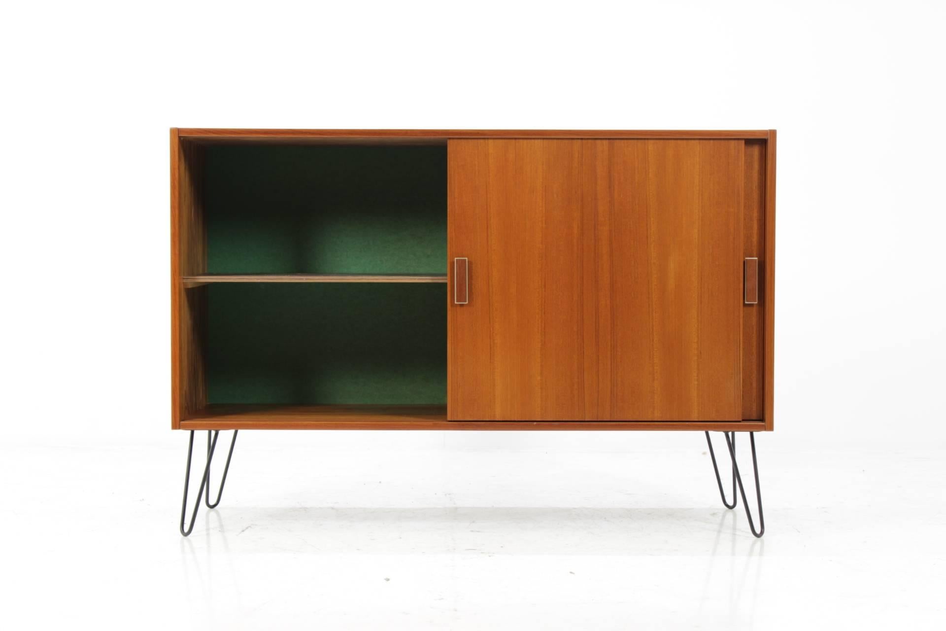 The item was carefully restored. The hairpin iron legs were added afterwards.