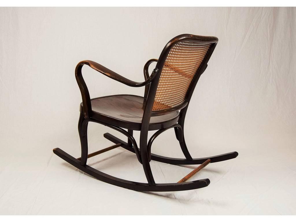 This rocking chair was made to order, circa in 1930 by Thonet Company, Austria. Rocking chair was designed by Josef Frank. Original good condition. Rocking chair was made from oak bentwood, stained to walnut color.