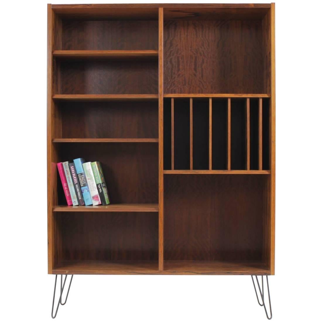 This bookcase was carefully restored. The hairpin iron legs were added afterwards. All shelves are adjustable.