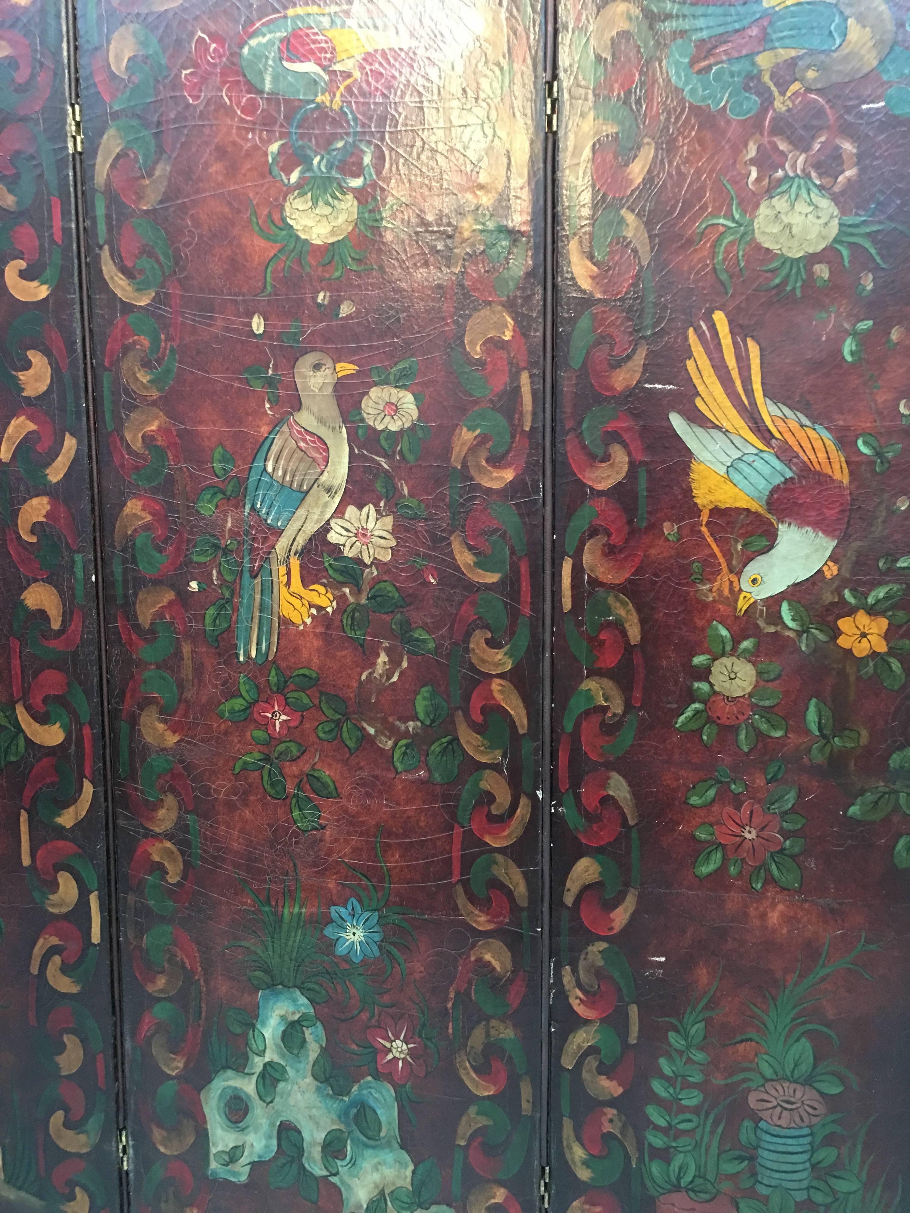 A stunning four fold painted leather Arts & Crafts screen. 

Painted on both sides with exotic birds and foliage, so eight painted panels in total. 

Studded around the edges and domed topped

 