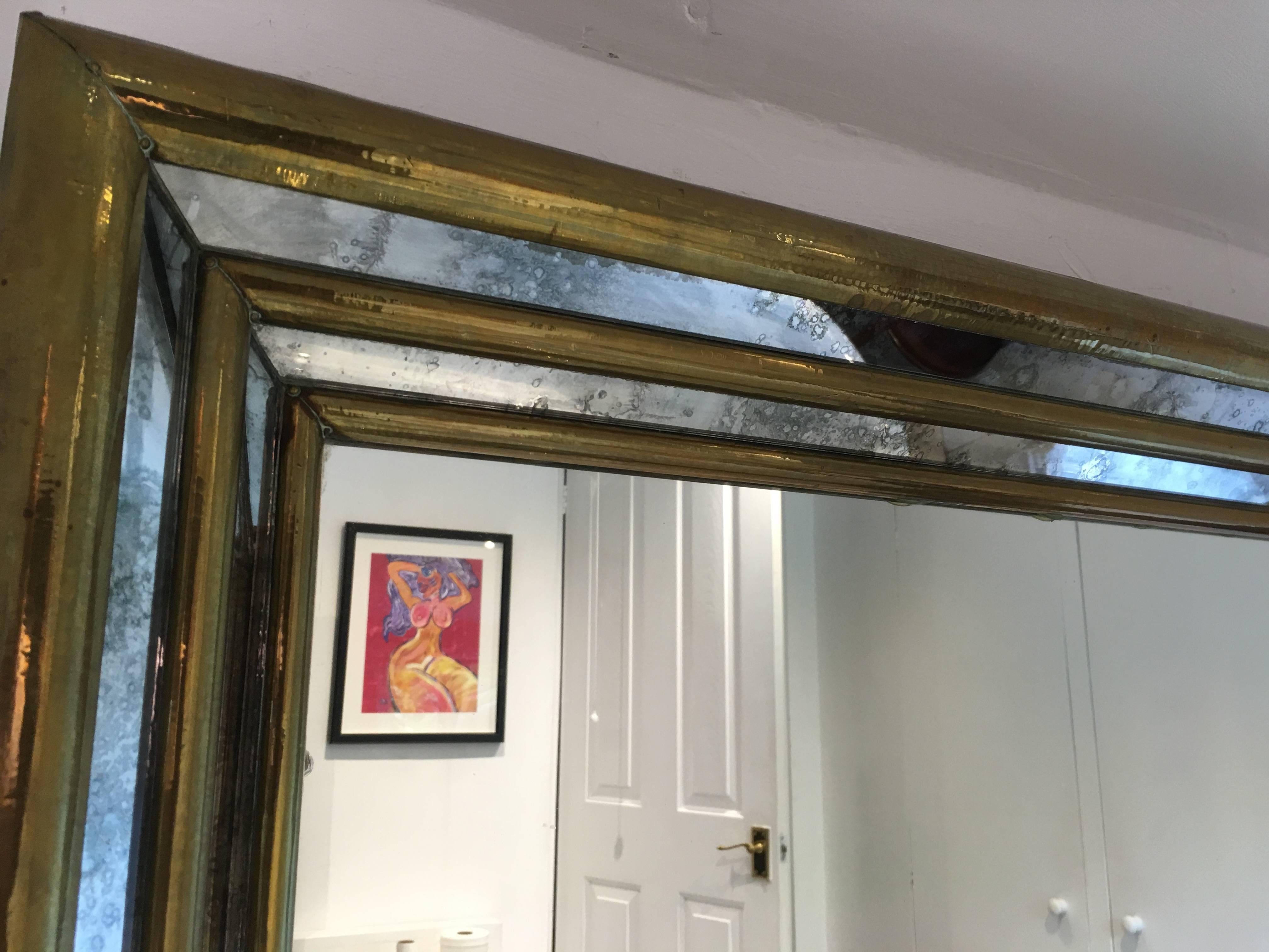 A superb stepped front mirror by Rodolfo Dubarry 

Hand-hammered brass cladding and with aged, smoked mirror glass

Beautifully signed in the bottom right hand corner and in wonderful condition

Spanish, circa 1970s.