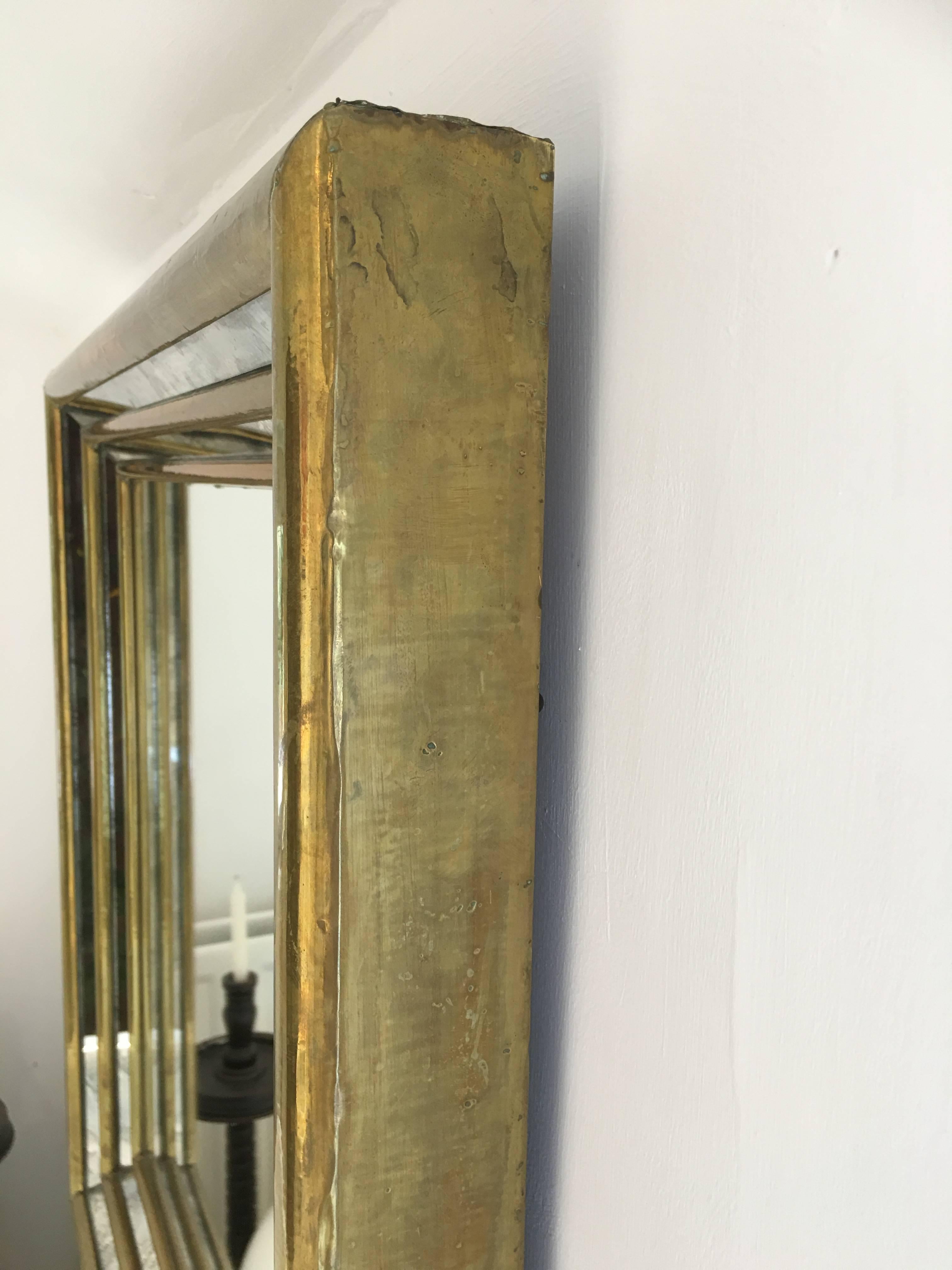 20th Century Rodolfo Dubarry gilt stepped front smoked mirror. Signed by the artist For Sale