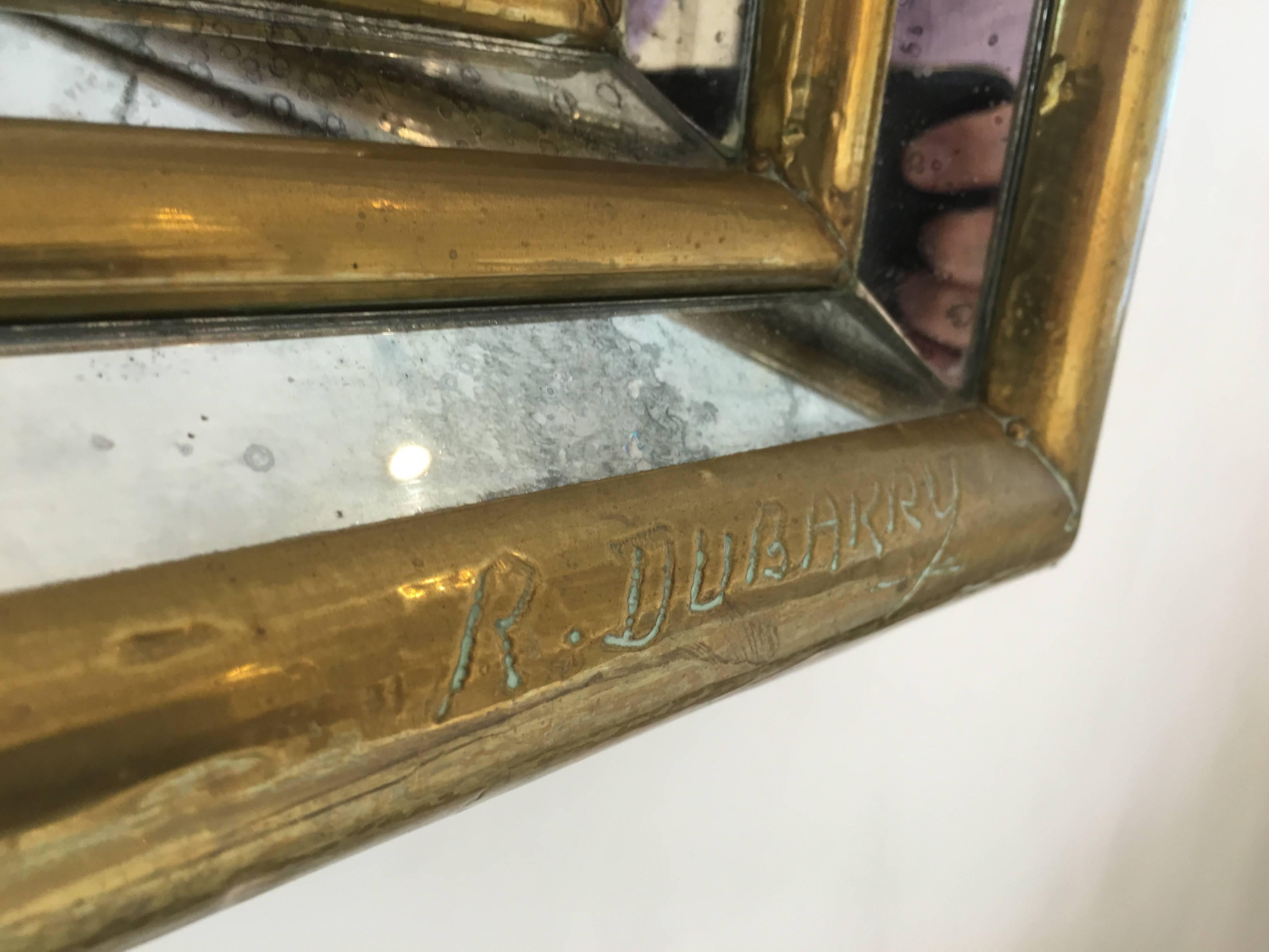 Brass Rodolfo Dubarry gilt stepped front smoked mirror. Signed by the artist For Sale