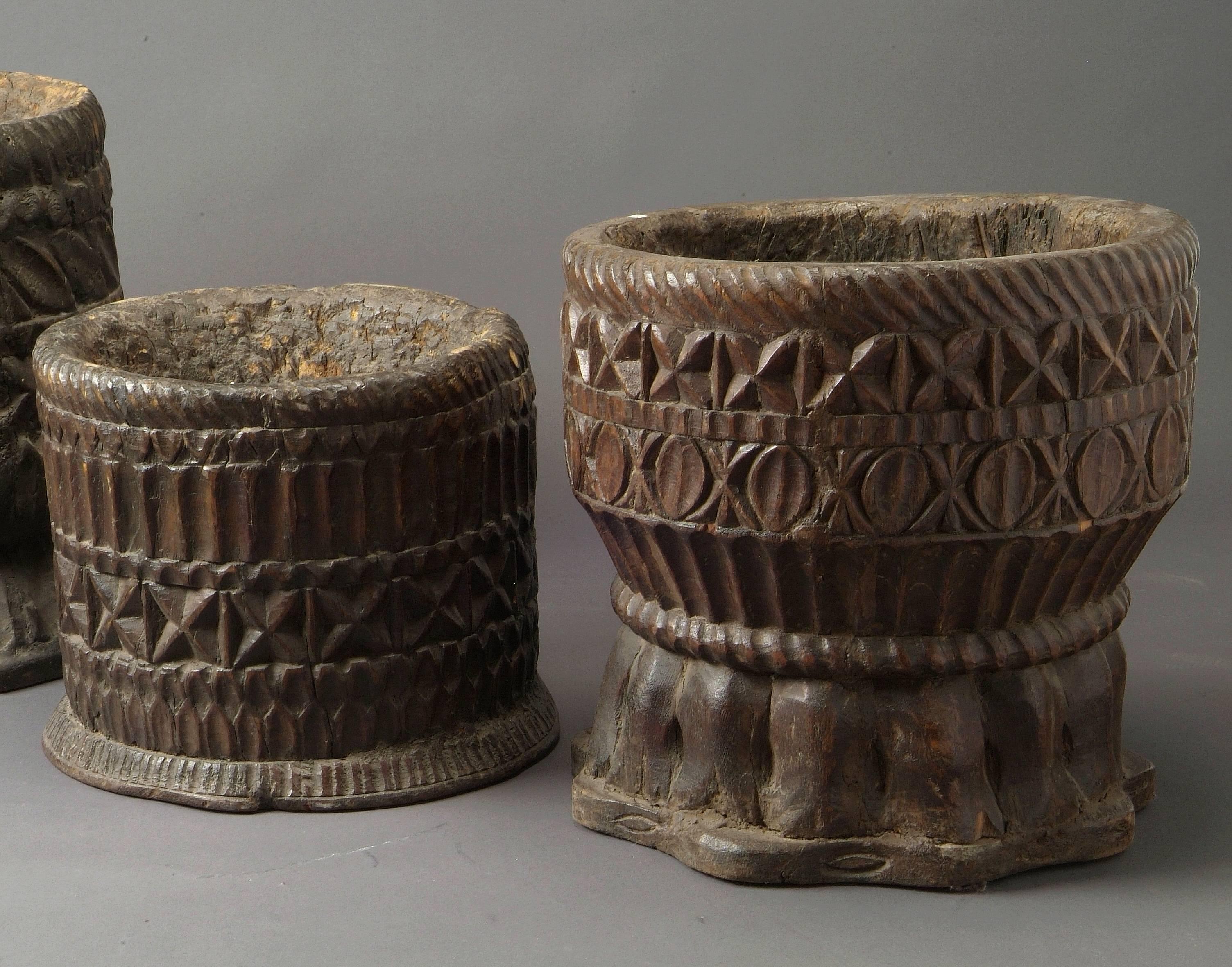 Three very rare wooden mortars carved in the form of elephant feet - India, Gujarat, late 18th century 
Dimensions: from left to right Ø.36 X H 43 - Ø.39 X H 28 - Ø.39 X H 38 cm.