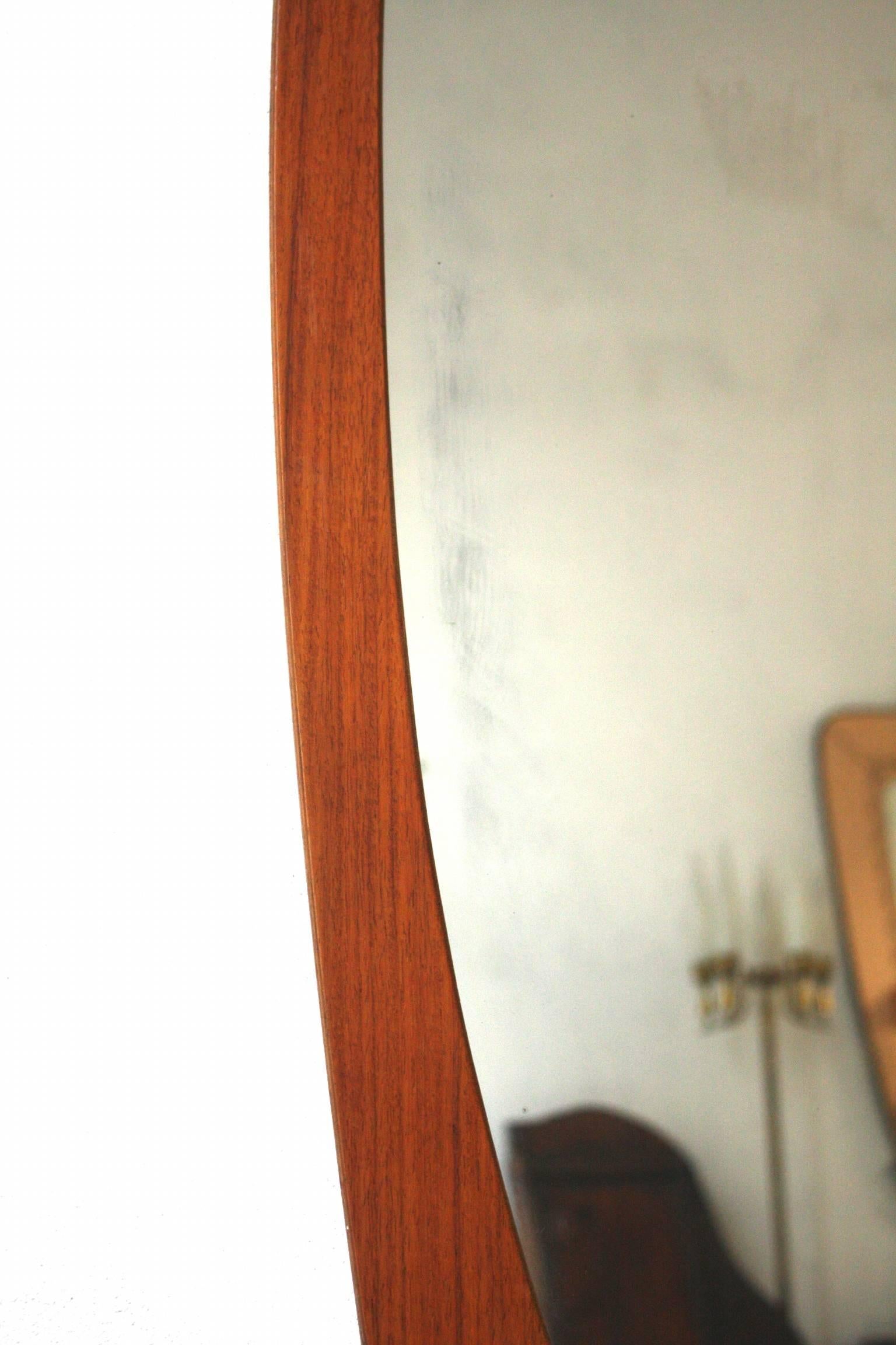 Wall mirror with curved plywood frame, designed by Franco Campo and Carlo Graffi for Home, Turin, in 1960.