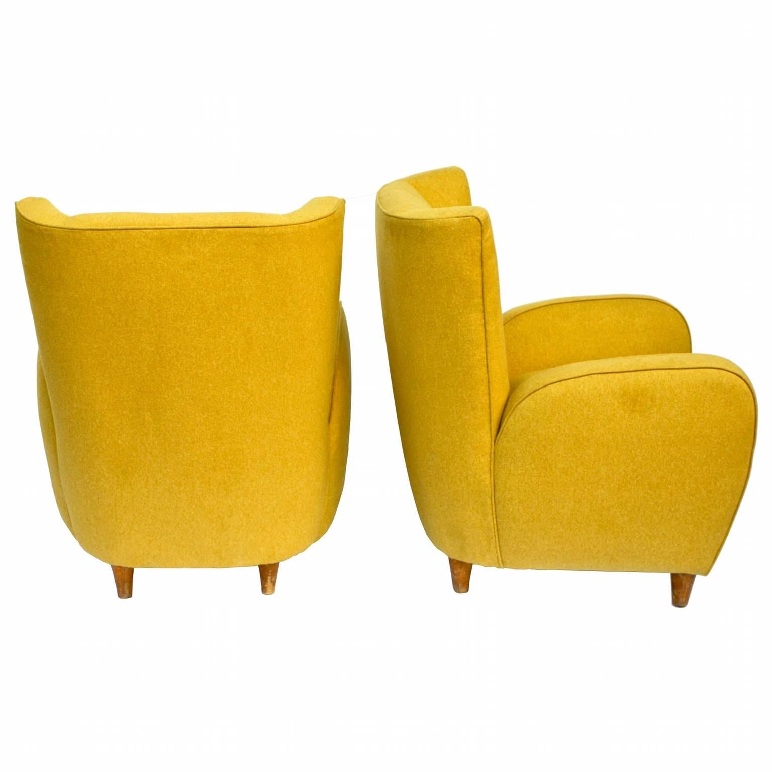 Pair of armchairs covered in fabric, wooden structure. Reupholstered and relined. From hotel Bristol of Merano, Italy, circa 1950.