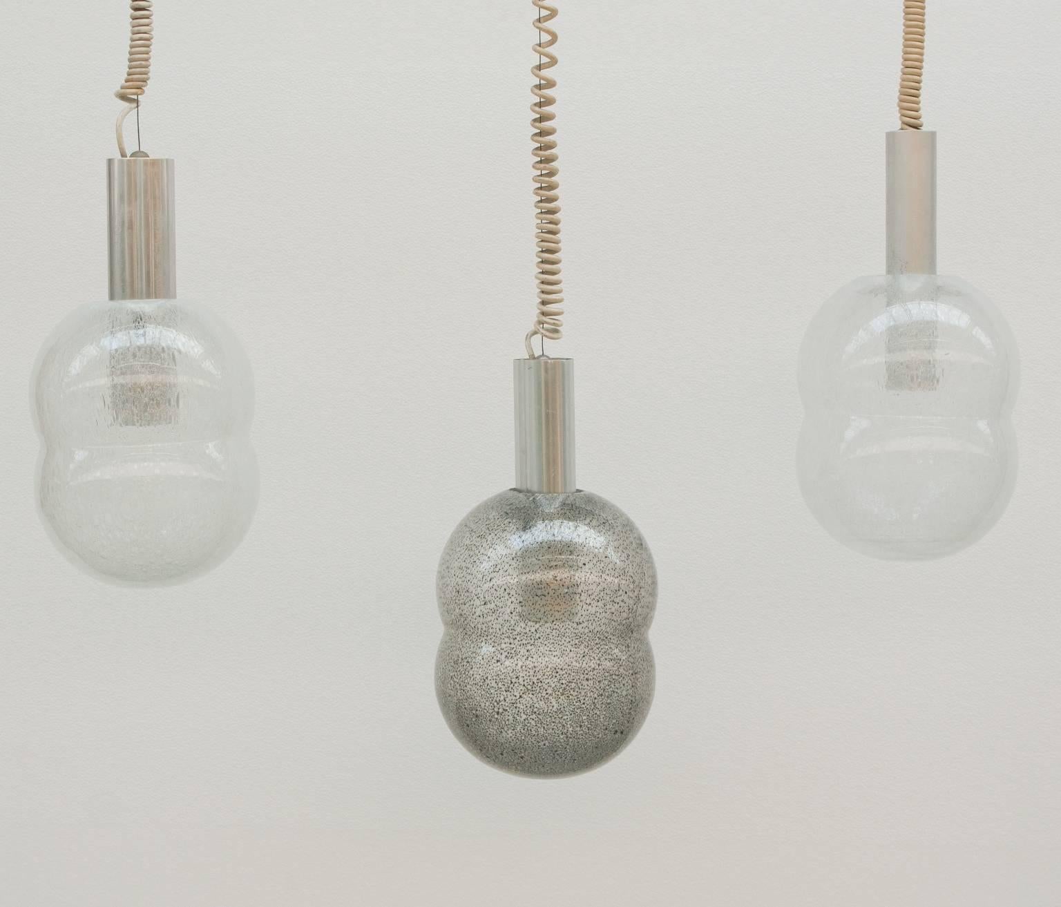 Tobia scarpa, flos, three bilobo hanging lamps. Blown glass (grey and white) and aluminium structure, 1965.
