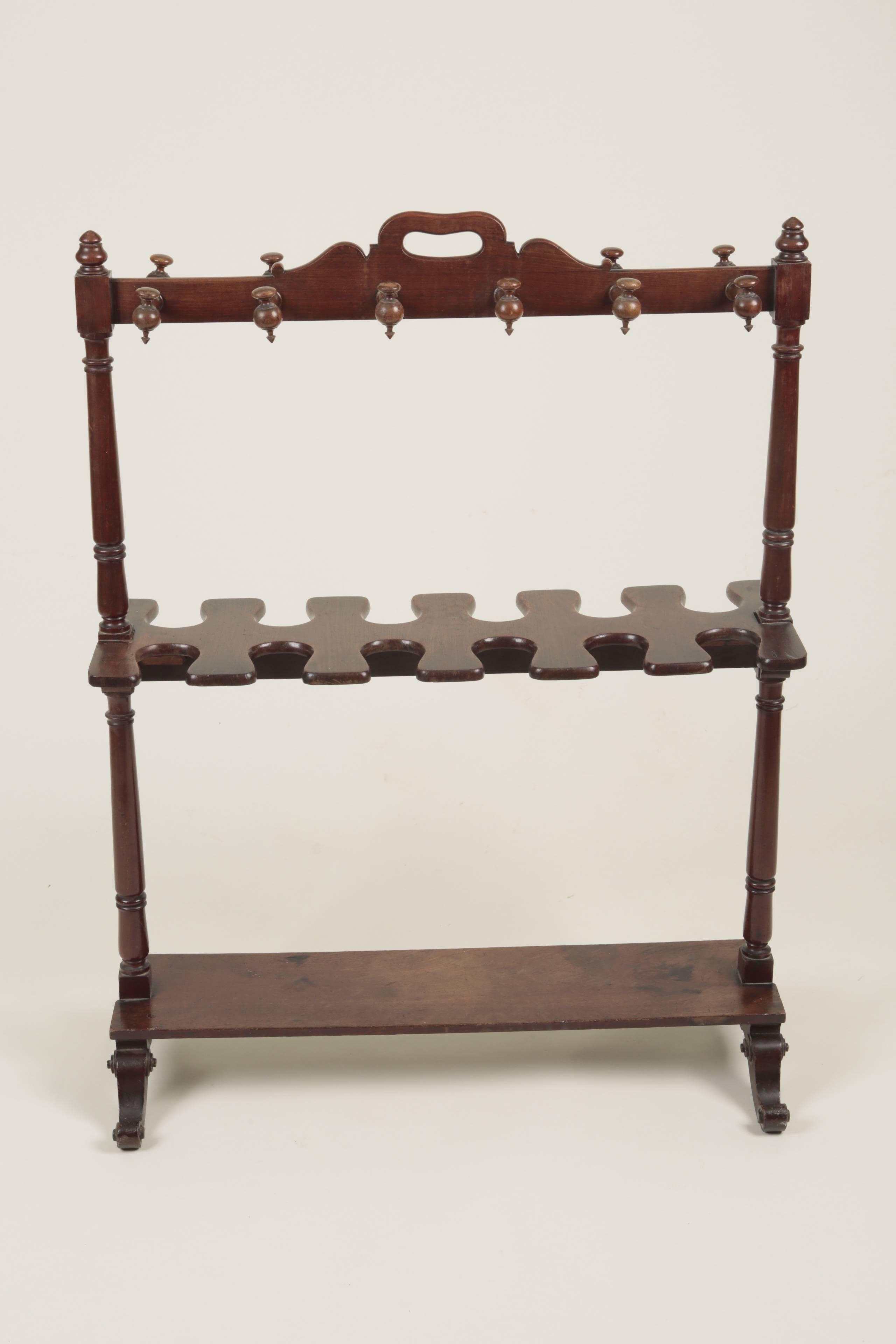 Mid-19th century mahogany boot rack and crop stand with platform base below. Good original condition.
(33cms front to back at feet).
