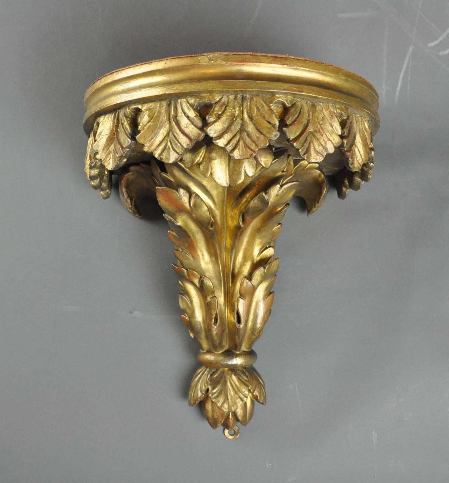 A good quality late 18th-early 19th century carved and gilded wall bracket.
