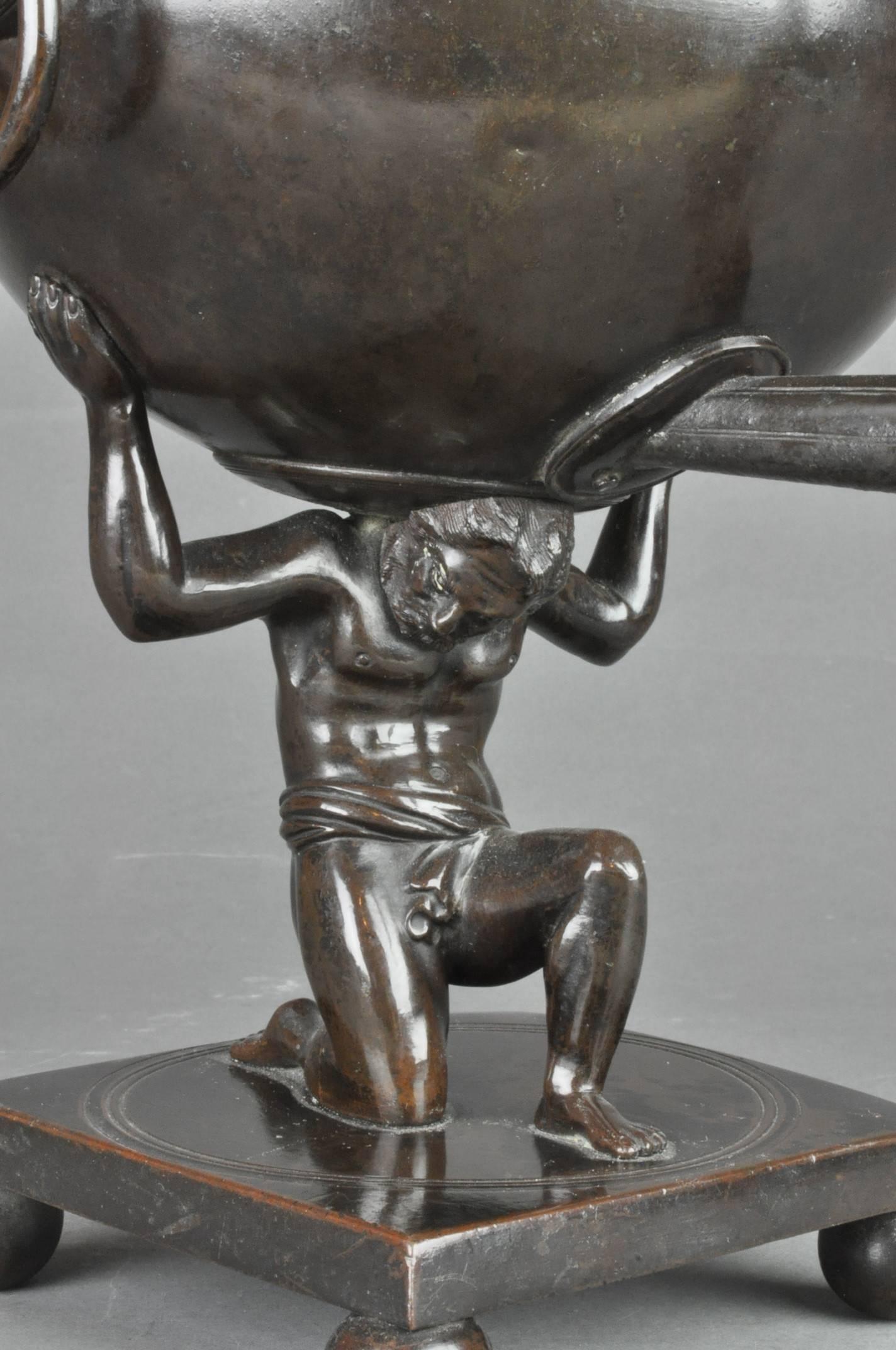 A fine and rare early 19th century bronze samovar in the form of Atlas supporting a celestial sphere on his shoulders. In complete and original condition with internal weighted fire brick.
 