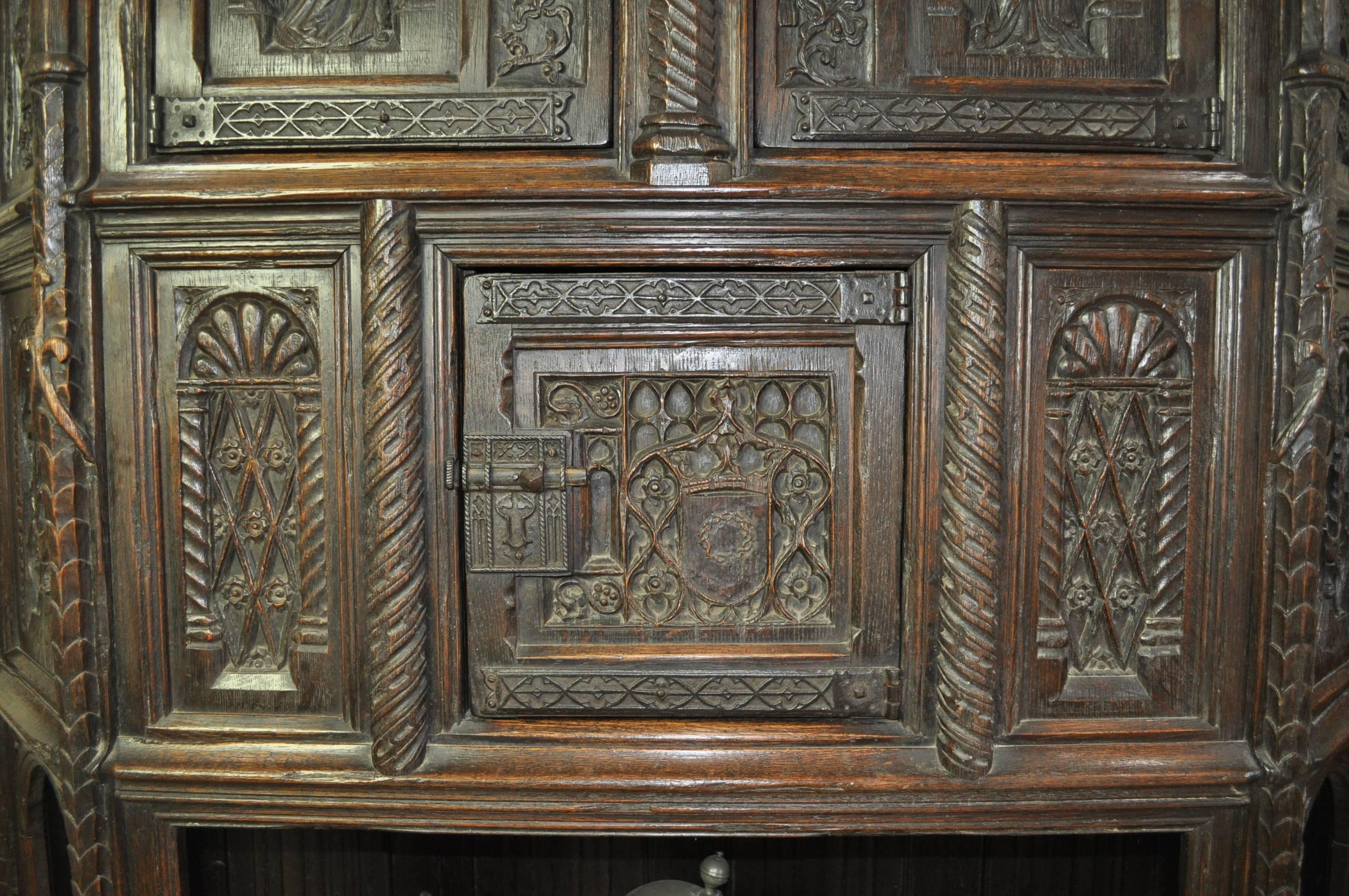 A highly imposing heavily carved 17th century French or Flemish oak credence cupboard.

Literature: For a similar piece see A HISTORY OF OAK FURNITURE by Fred Roe R.I., plate XXXIII, 