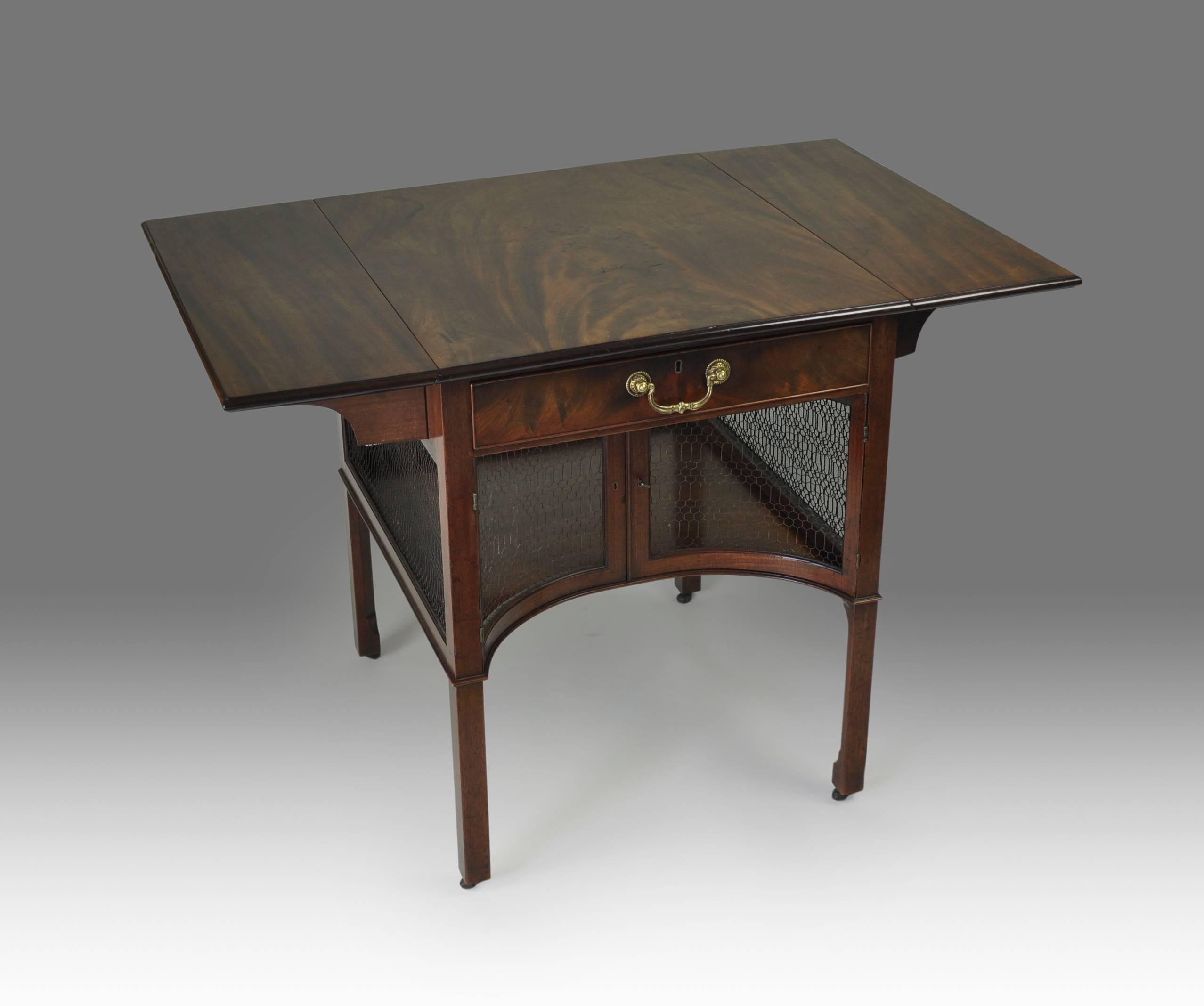 Attributed to Chippendale
An exceptional and rare Chippendale design mahogany breakfast or supper table of the highest quality, the plain top with drop-flaps and moulded edge above a single apron drawer and wire-caged compartment below. Standing on