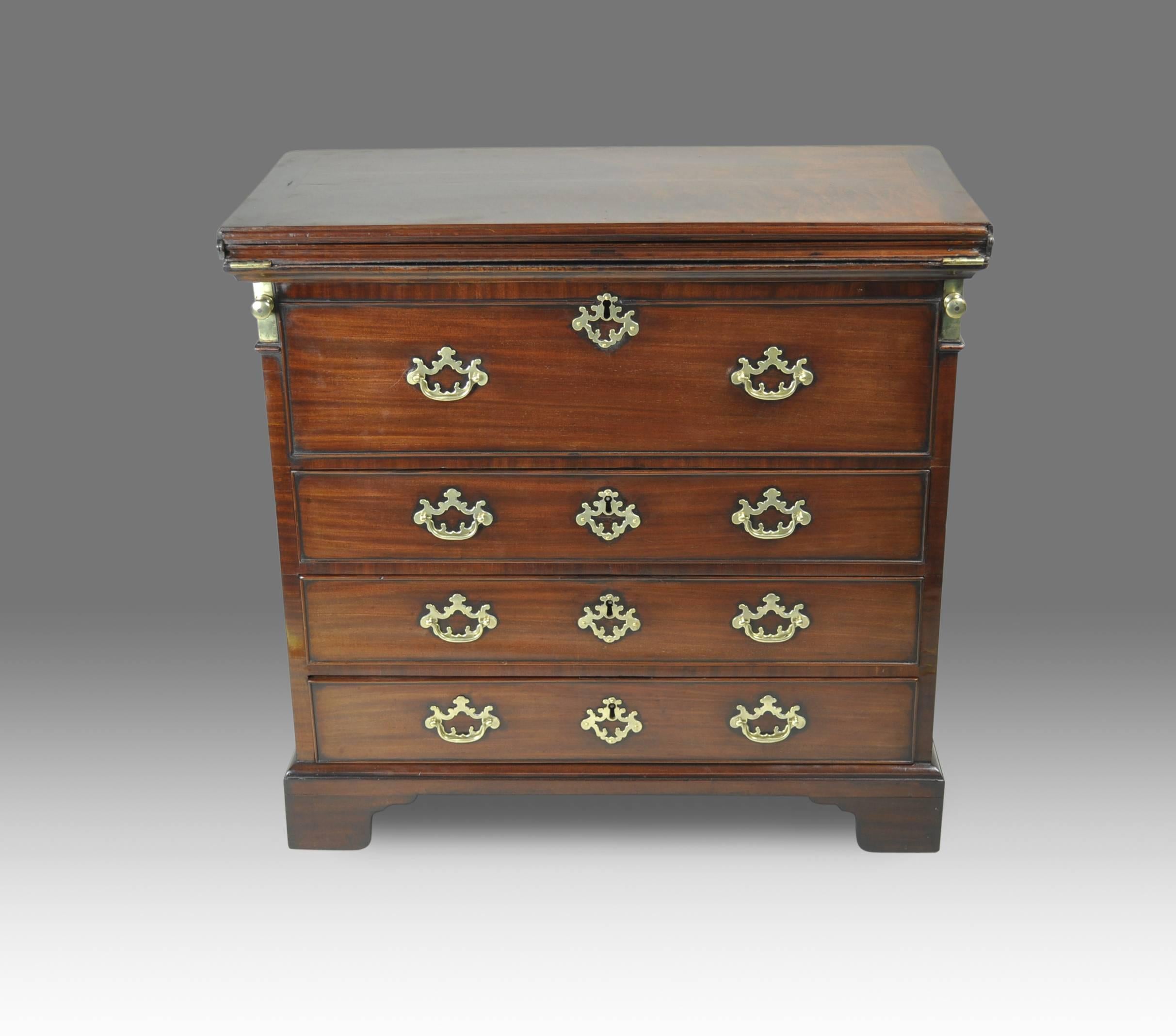 FOR A VIDEO DESCRIPTION OF THIS ITEM, COPY AND PASTE THIS LINK:  https://youtu.be/WcBsjfE-rkc 

An exceptionally rare metamorphic mid-18th century bachelor’s Chest in mahogany with brass hardware. The fold-over top opening to reveal a polished