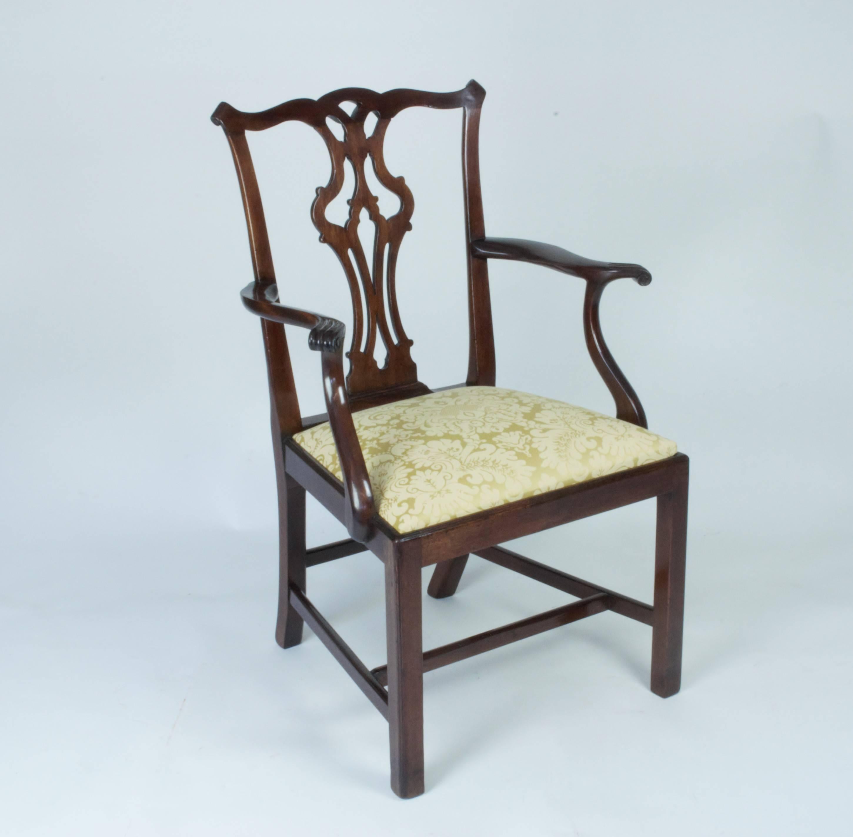 Good set of eight Country Chippendale design mahogany dining chairs, including two carvers. The pierced vase shaped splat backs above drop-in seats and standing on square chamfered legs with stretchers.
Seats re-upholstered in quality Giansborough